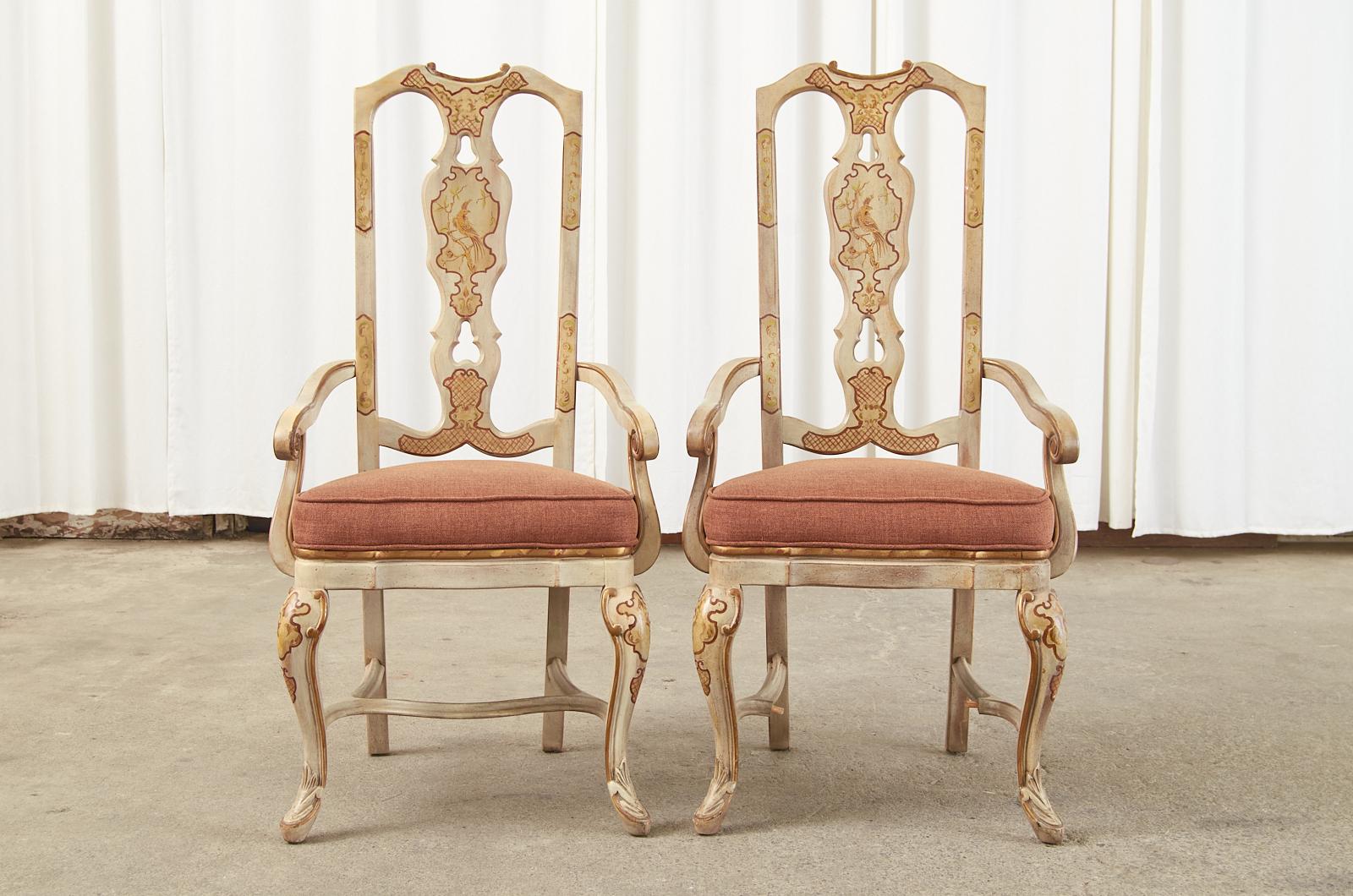 Lacquered set of eight dining chairs made in the English Queen Anne style featuring chinoiserie decorations. The set consists of two armchairs measuring 22 inches wide and six side chairs. The hardwood chair frames have a parcel gilt accents and an
