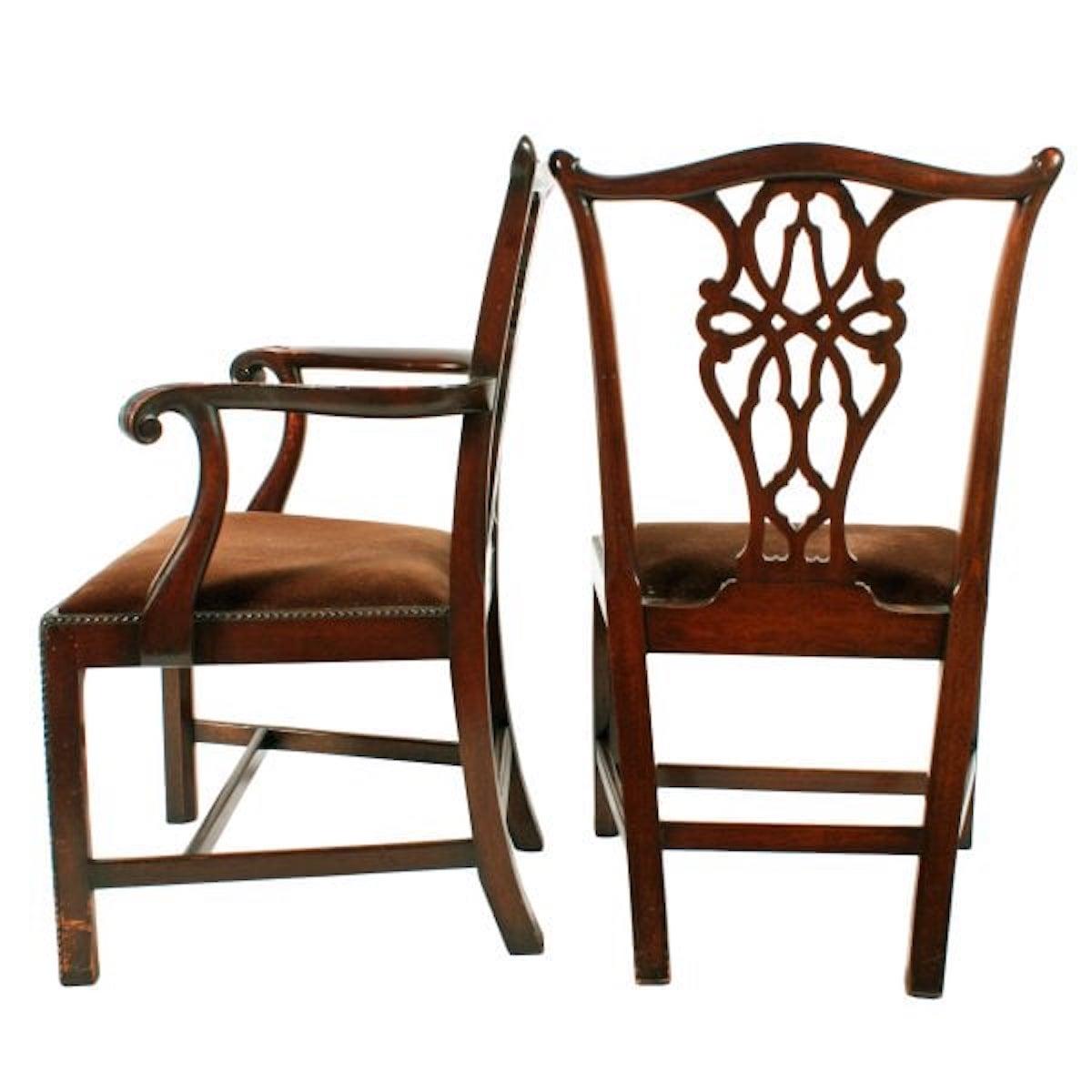 Set of Eight Chippendale Style Chairs

A set of Georgian style Chippendale mahogany dining room chairs.

The set comprises six single chairs and a pair of elbow chairs.

The chair backs have a serpentine shaped top rail with a broad pierced