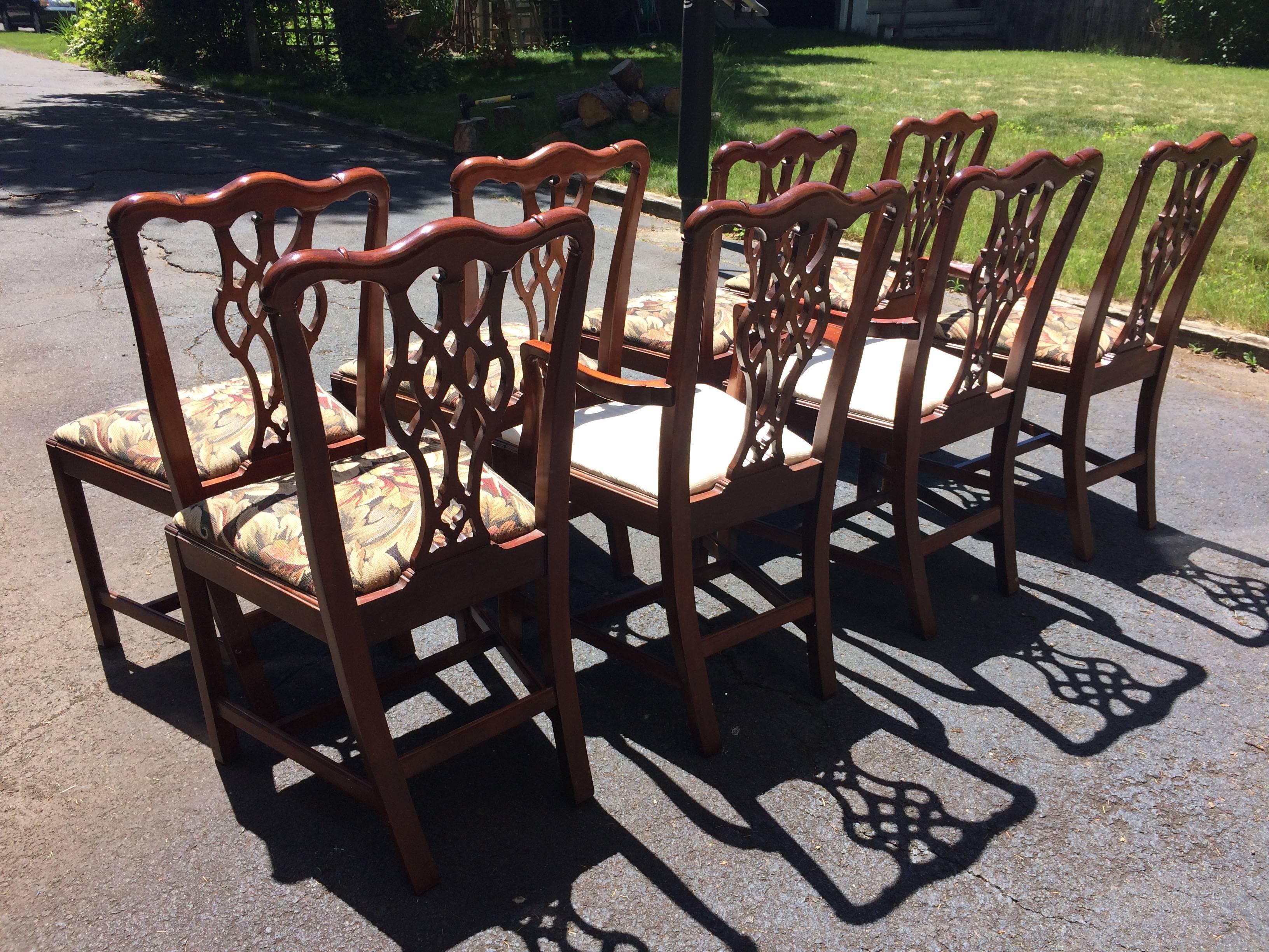 Set of Chippendale style traditional carved wood dining chairs with upholstered seats, having two-arm chairs and six side chairs. The arm chairs' fabric should be replaced.
The tapestry seats on the side chairs are in good condition. By Hickory