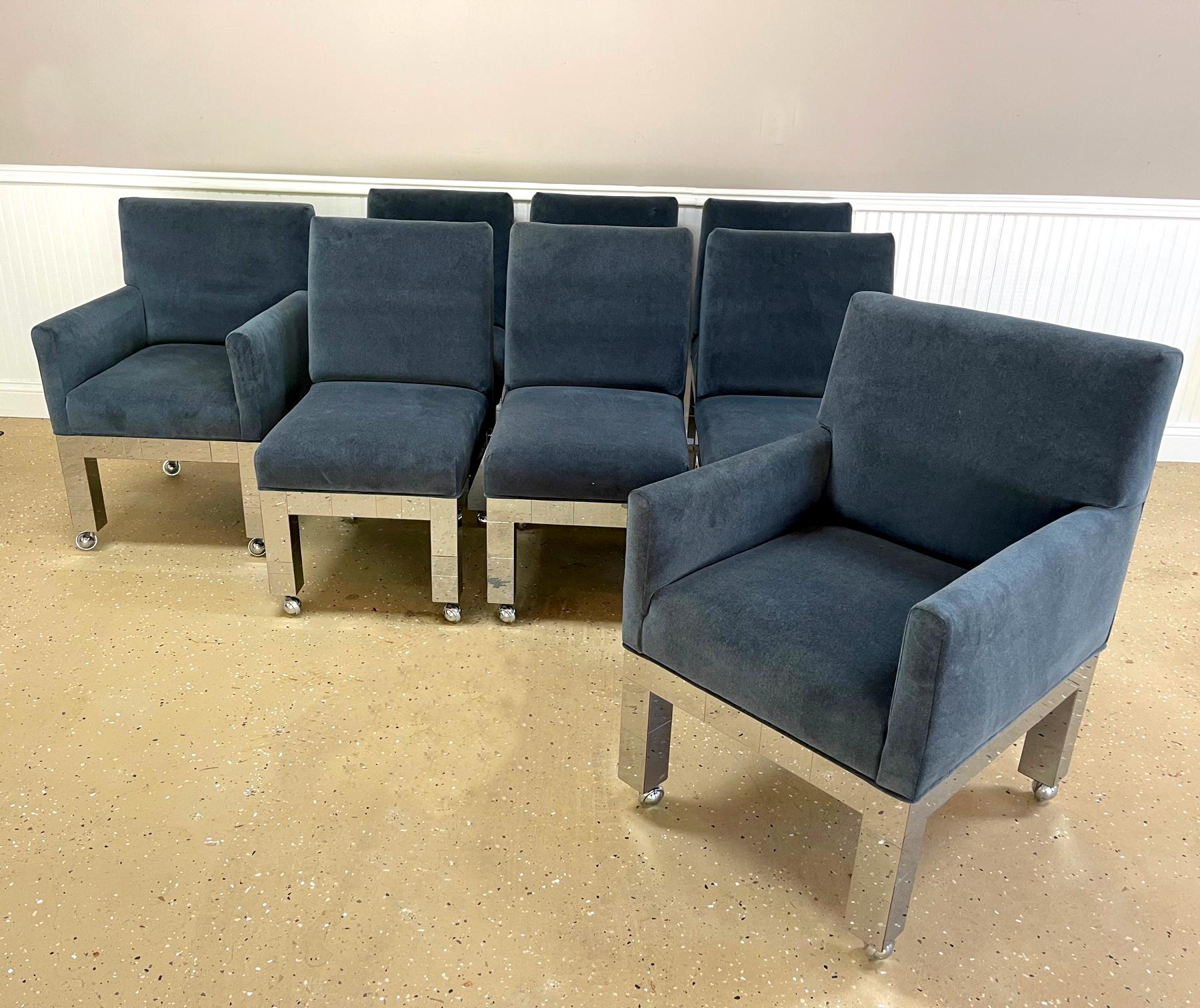 A nice set of eight cityscape dining chairs by Paul Evans for Directional, circa 1974. The set consists of two armchairs model PE-241 and six side chairs model PE-240. Chromed steel patchwork legs with a more recent slate-blue velvet upholstery. All