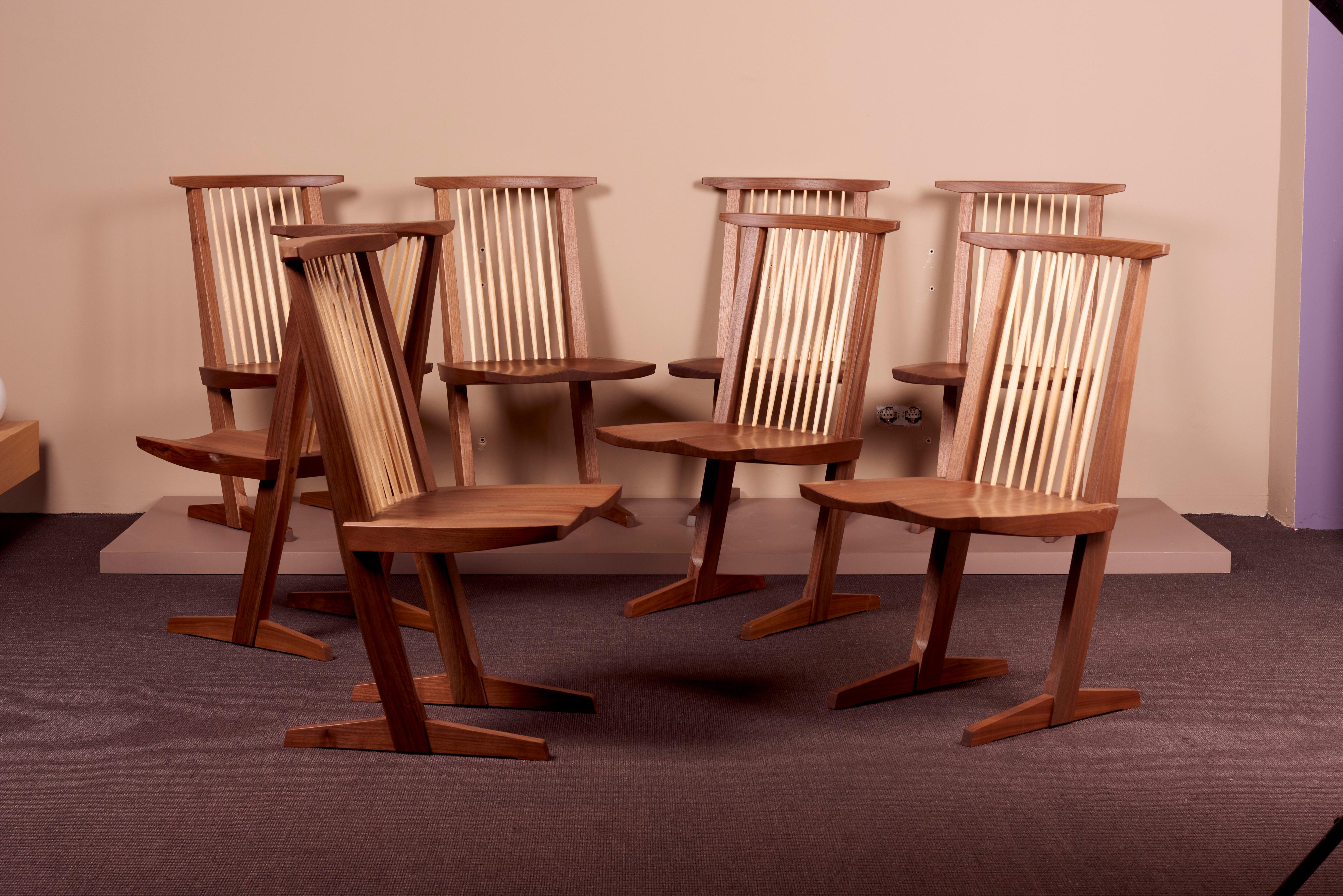 Set of 8 Conoid Dining chairs by Mira Nakashima based on a design by George Nakashima. All chairs can be signed (just an example on the photo). Important: Please consider the production lead time of about 18 months. 
    