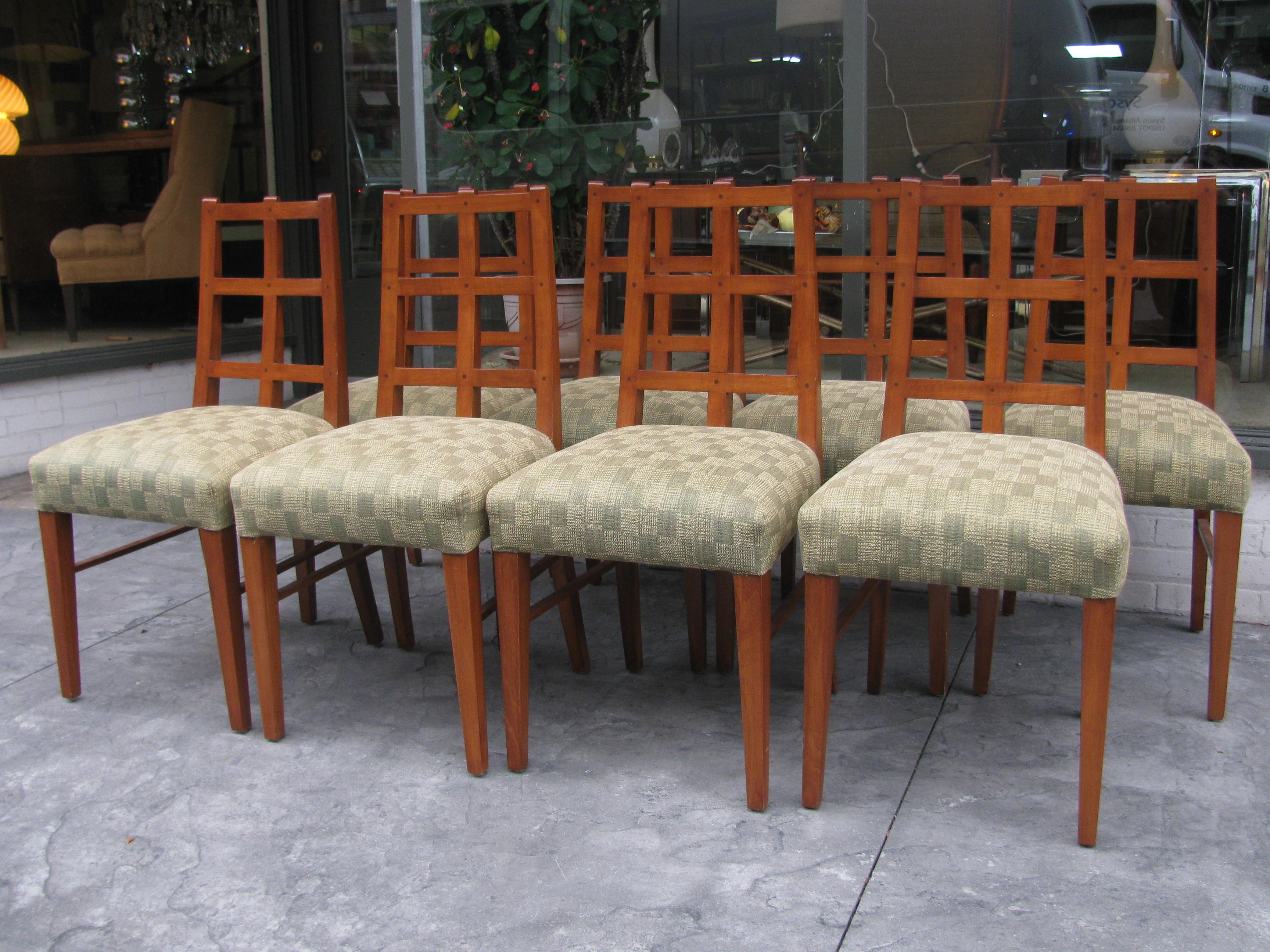 Exceptional set of custom made dining chairs all handmade and newly upholstered. Original design was for a NYC restaurant. Chairs are a blend of Arts & Crafts meets midcentury. Backs of the chairs cross sections are all pinned with wood pegs, just