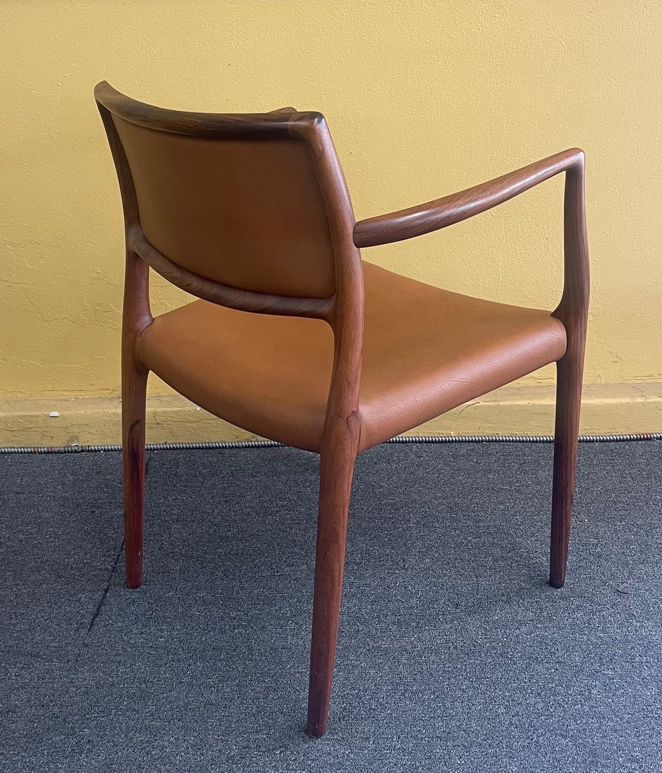 Set of Eight Danish Modern Rosewood Model 65 Arm Chairs by Niels Moller 6