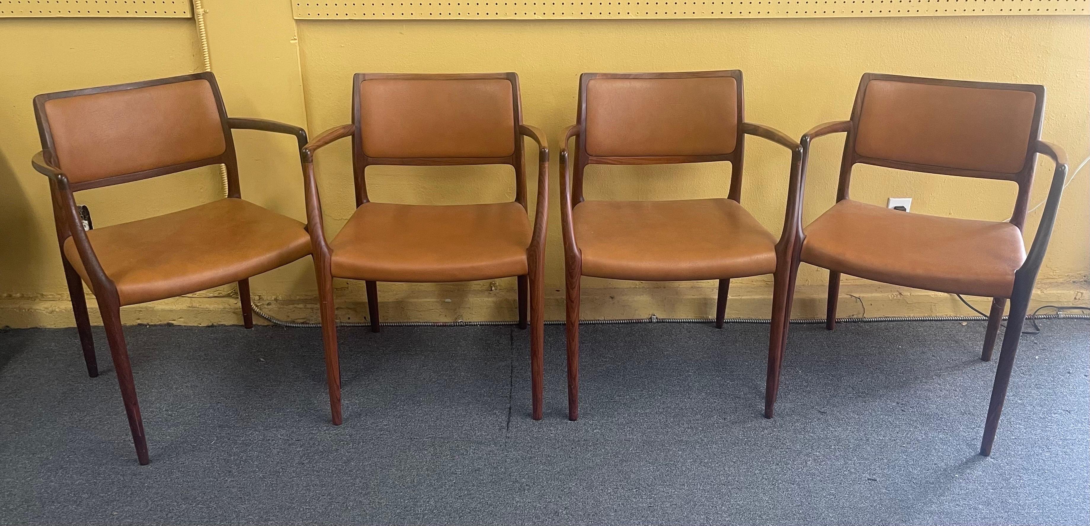 Set of Eight Danish Modern Rosewood Model 65 Arm Chairs by Niels Moller 1