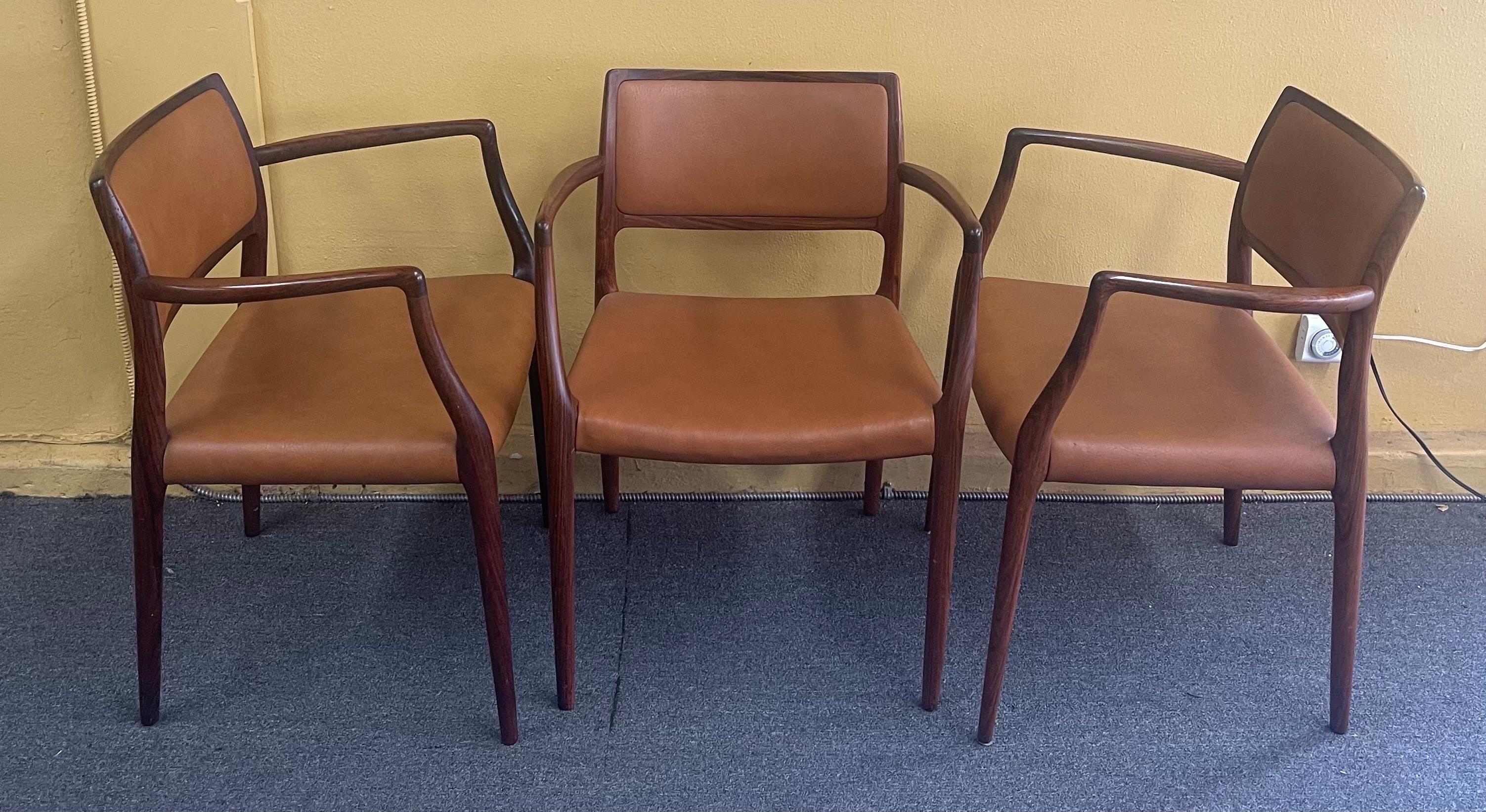 Set of Eight Danish Modern Rosewood Model 65 Arm Chairs by Niels Moller 2