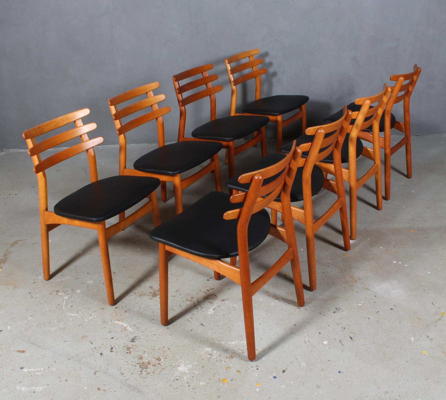 Set of eight Danish vintage dining chairs in beech designed by Poul Volther for FDB.

New upholstered with semi aniline black leather.

Model J48, made by FDB.
 