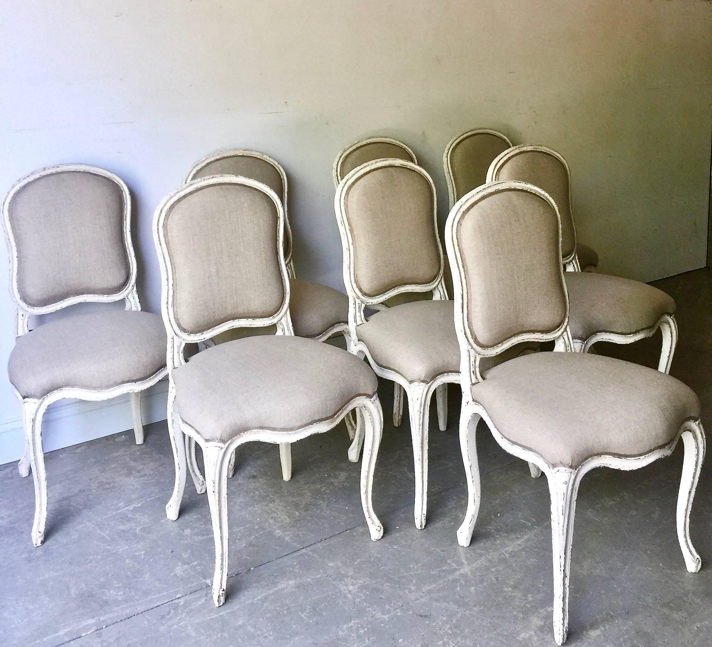 Early 20th Century Set of Eight Decoratively Carved French Louis XV Style Chairs