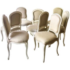 Set of Eight Decoratively Carved French Louis XV Style Chairs
