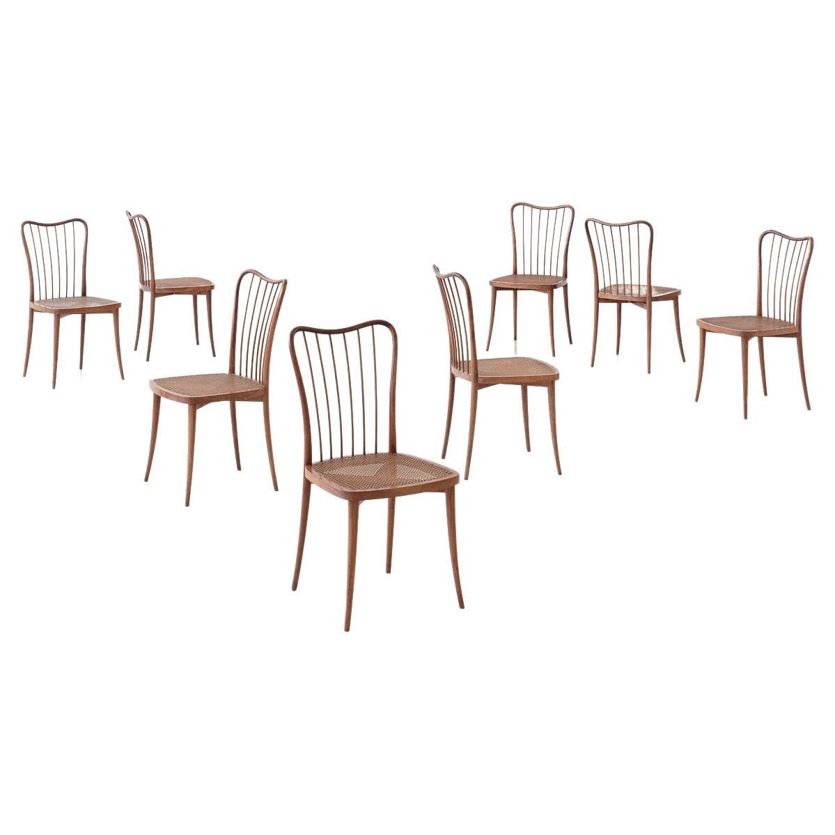 Ensemble de huit chaises de salle à manger par Joaquim Tenreiro, bois massif et rotin, années 1950