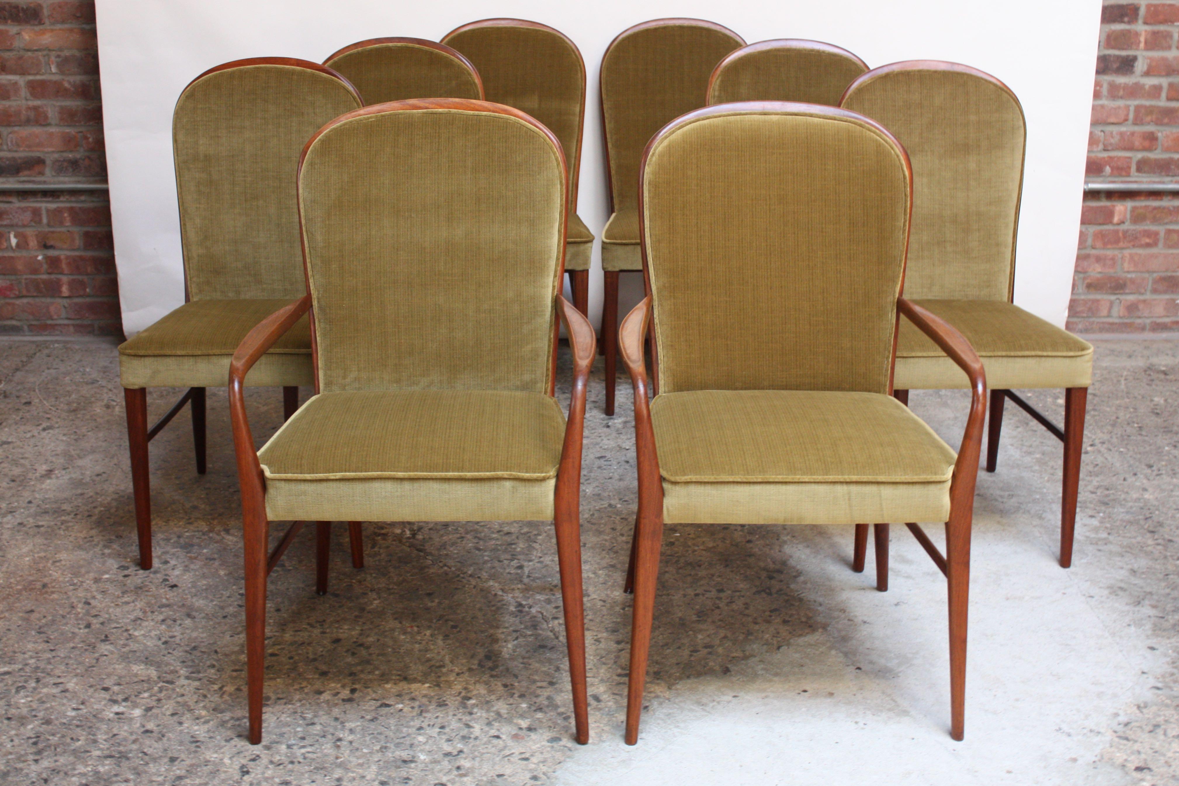 Rare set of Paul McCobb for H Sacks & Sons dining chairs (two captains and six side) composed of hand-carved walnut frames with sage velvet upholstery (front and back) in place of the original caned back. Set boasts dramatic lines with the sculpted