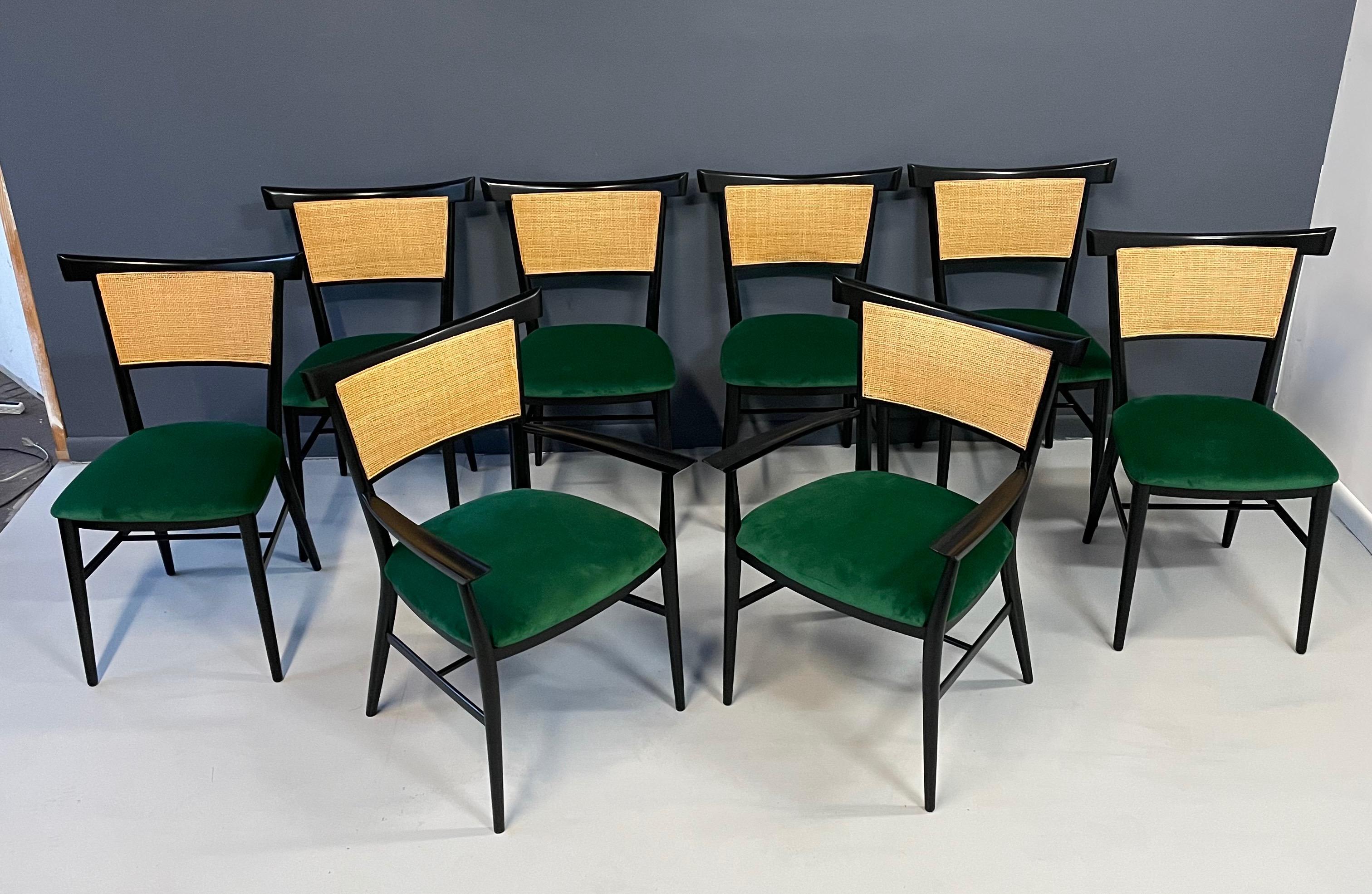 Set of eight dining chairs, designed by Paul McCobb for Winchendon, circa 1950s. This set has been completely restored in a black lacquer with a sexy green velvet upholstery and newly caned back. 
The two armchairs measure 35.5