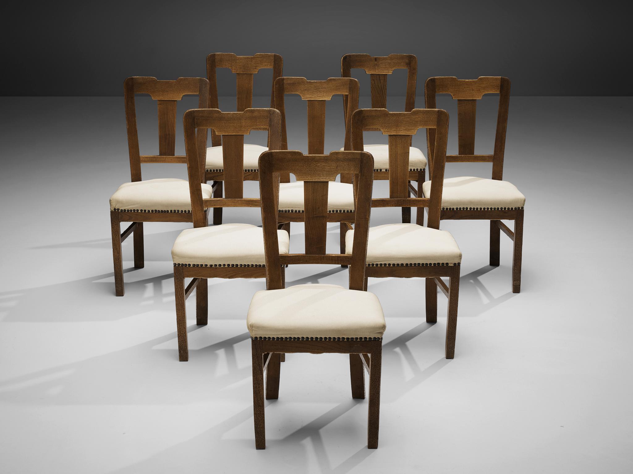 Ernesto Valabrega, set of eight dining chairs, stained oak, fabric upholstery, Italy, ca. 1935

This set of dining chairs by Ernesto Valabrega not only shows a well-balanced backrest but also lovely details like the brass nails holding the seating