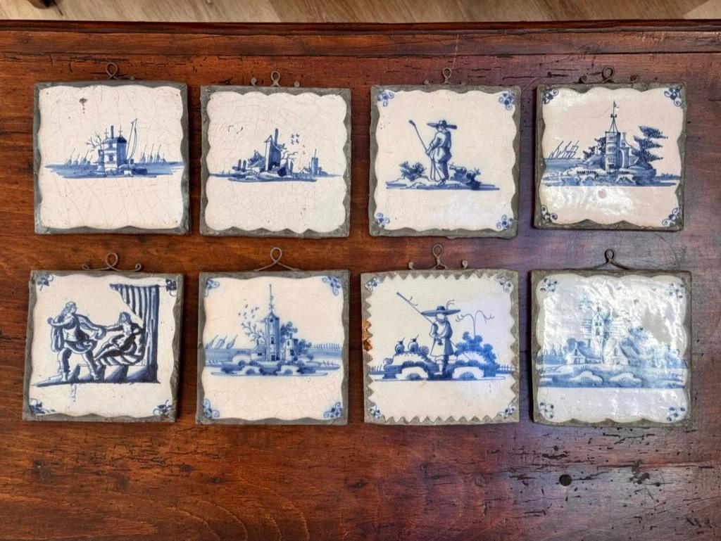 Set of 8 metal mounted Dutch delft tiles, 18th century.  5.25” h.

