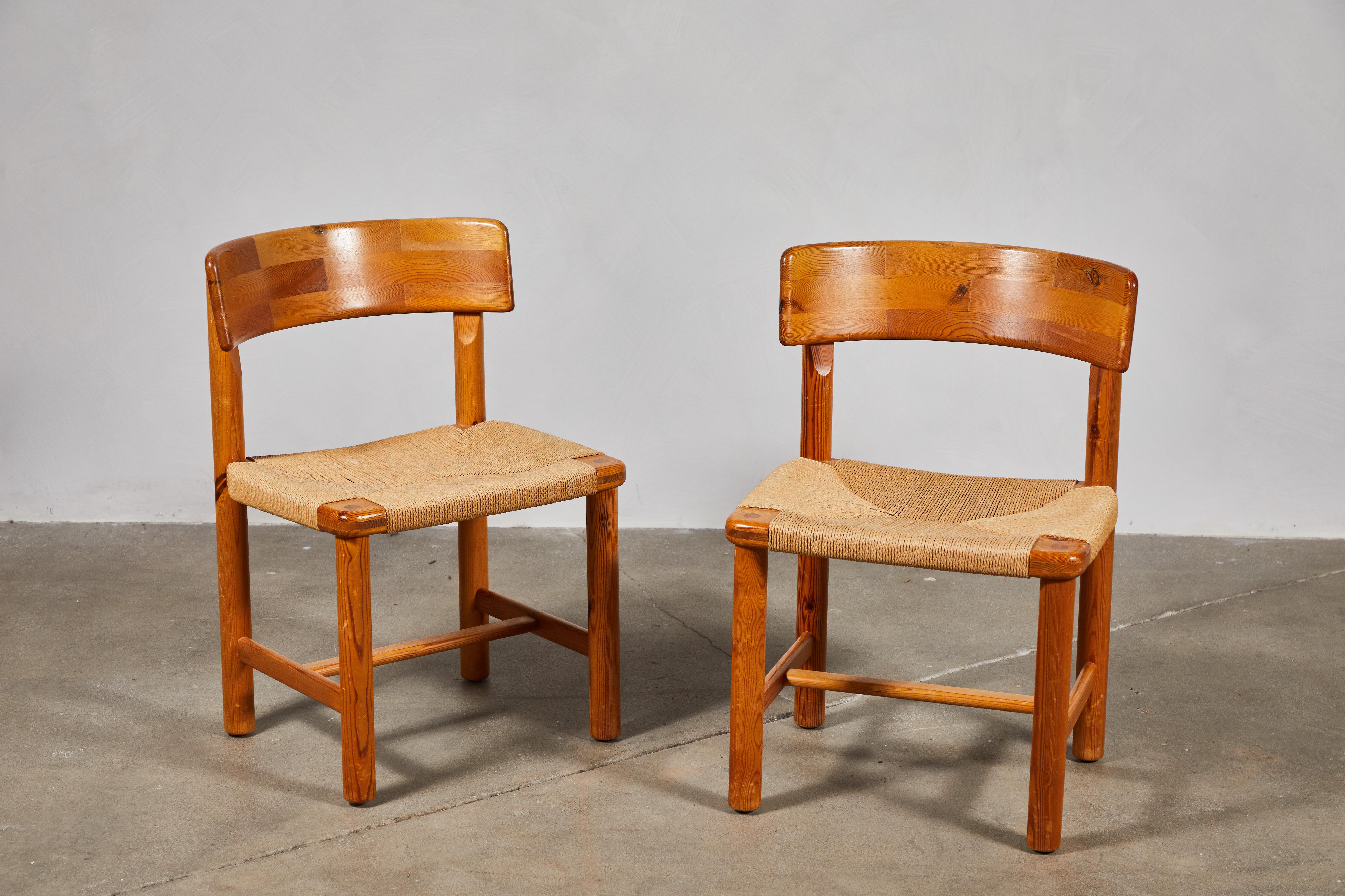 Set of eight French mid century wooden dining chairs with original rush seat which is in great condition.