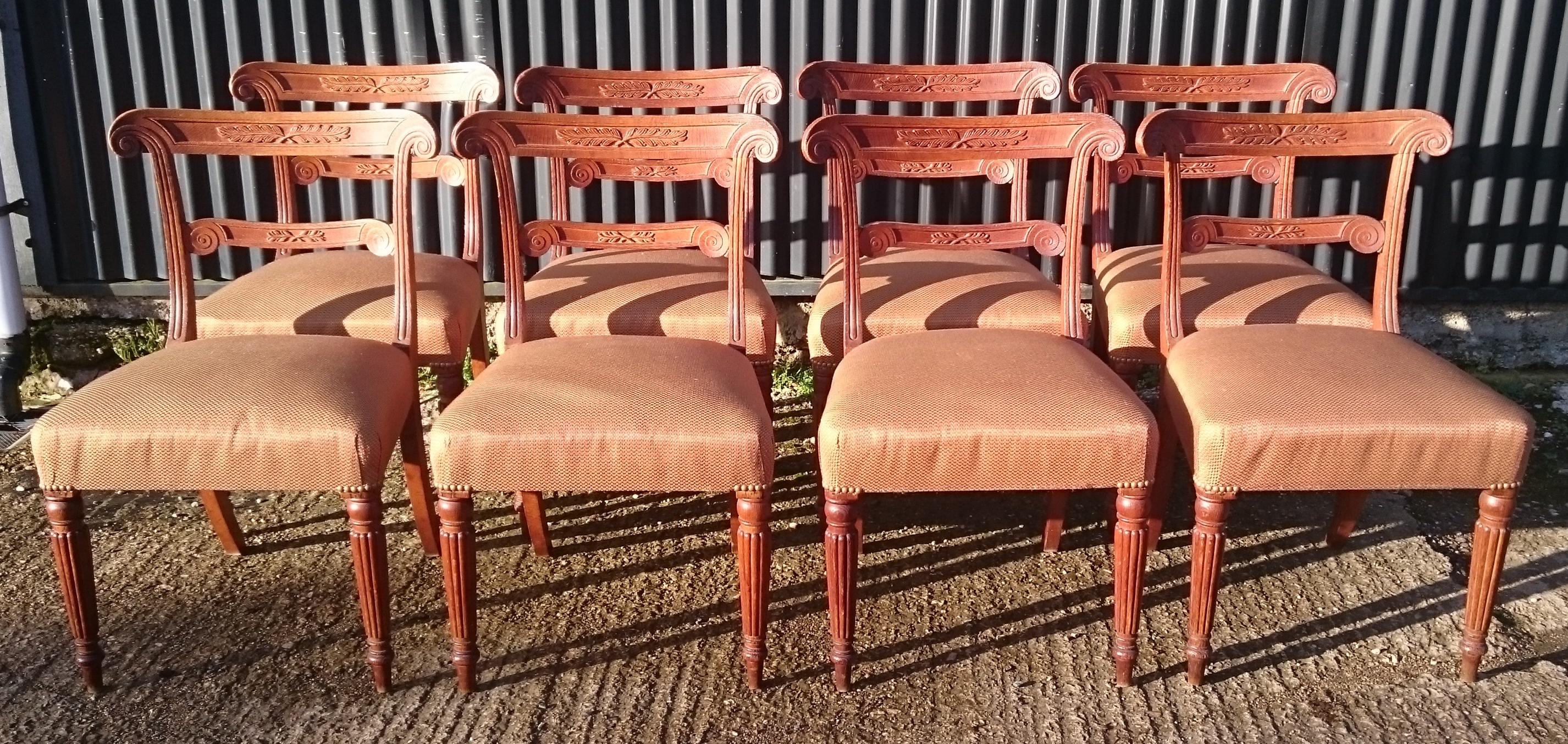 Set of eight Regency dining chairs standing on turned and reeded legs with exceptionally fine carving and a very generous shape overall, especially to the rear uprights and back leg. The rear uprights also have a very well drawn moulded detail which