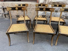 Set Of Eight Ebonised Beechwood and Caned Regency Period Dining Chairs