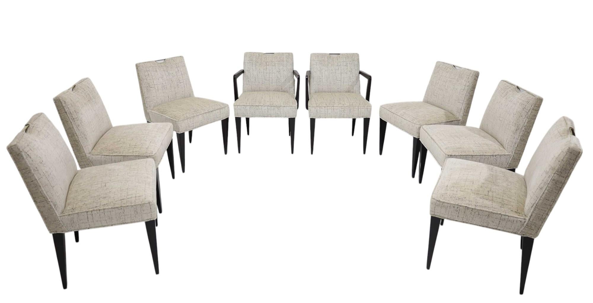 Experience the epitome of mid-century elegance with this set of eight dining chairs designed by Edward J Wormley for the esteemed Dunbar Furniture Company. Featuring the impeccable Models 4592 (armless) and 4593 (armed) chairs, each piece showcases