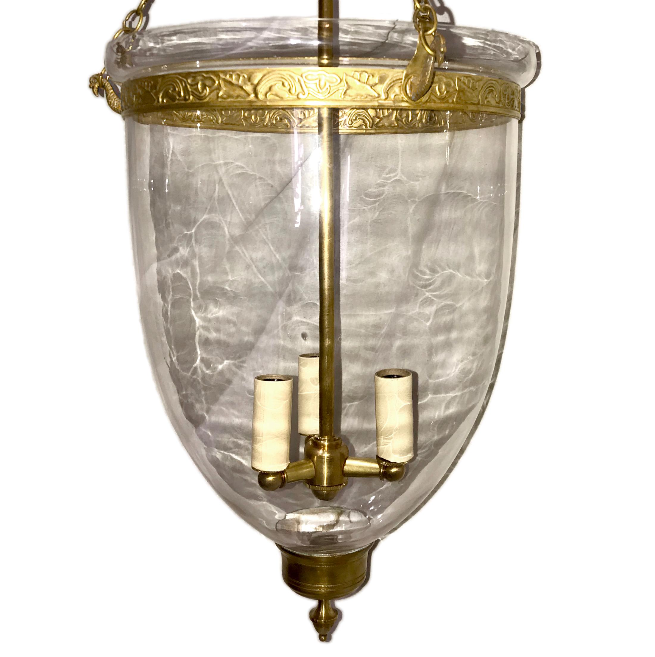 Set of circa 1930's English blown glass bell-jar lanterns with brass fittings. Sold Individually

Measurements:
Diameter 12
