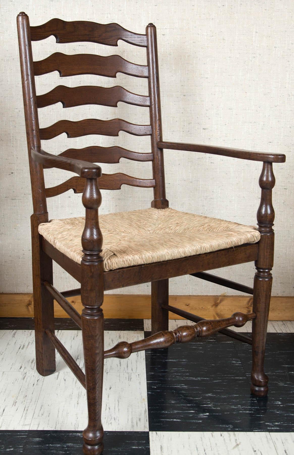 British Custom Set of Eight English Oak Wavy Ladder Back Chairs with Rush Seats For Sale