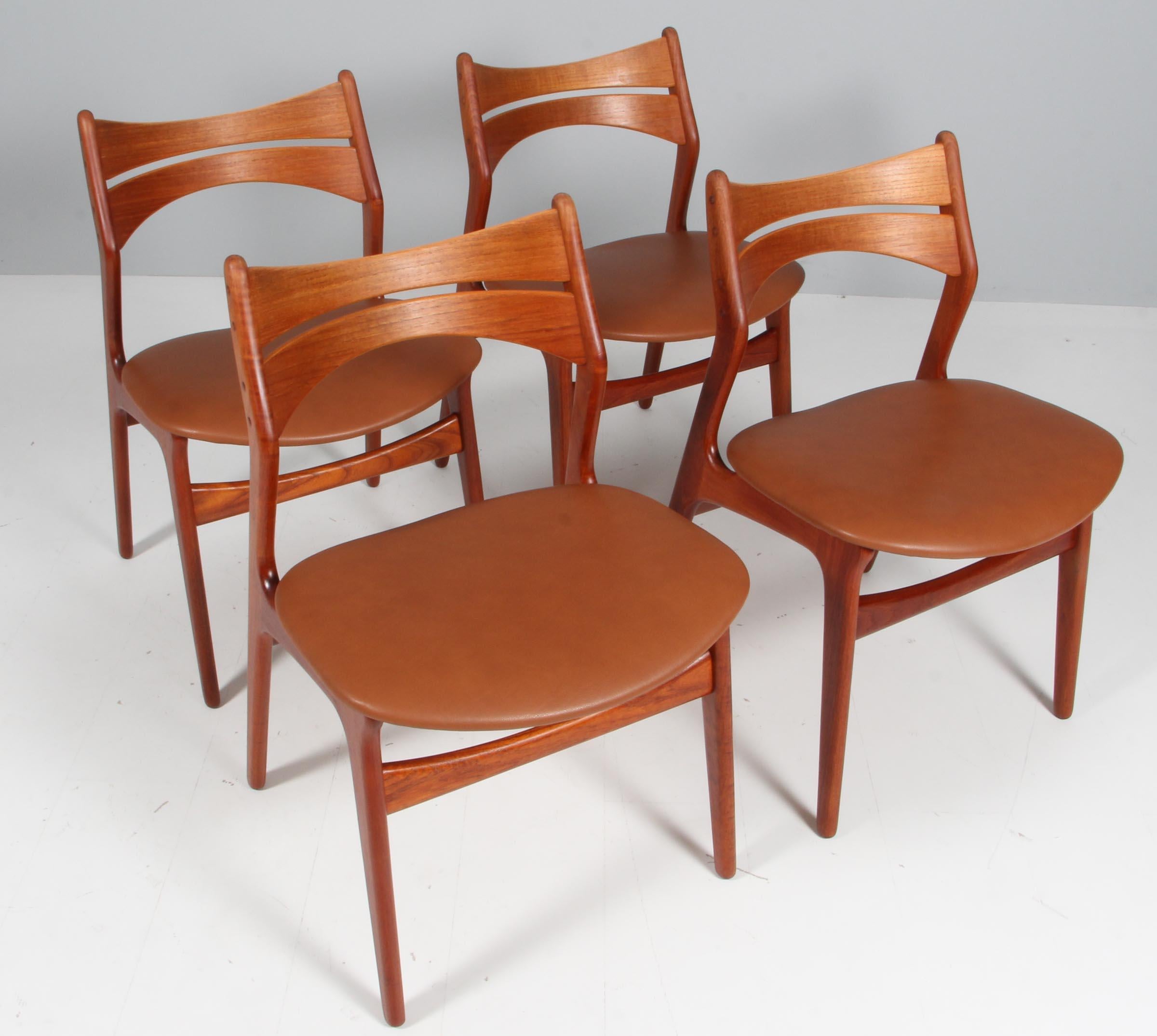 Eight Eric Buch chairs with frame of partly solid teak.

New upholstered with vintage tan aniline leather. 

Model 310, made by Chr Christensens Møbelfabrik, Denmark.