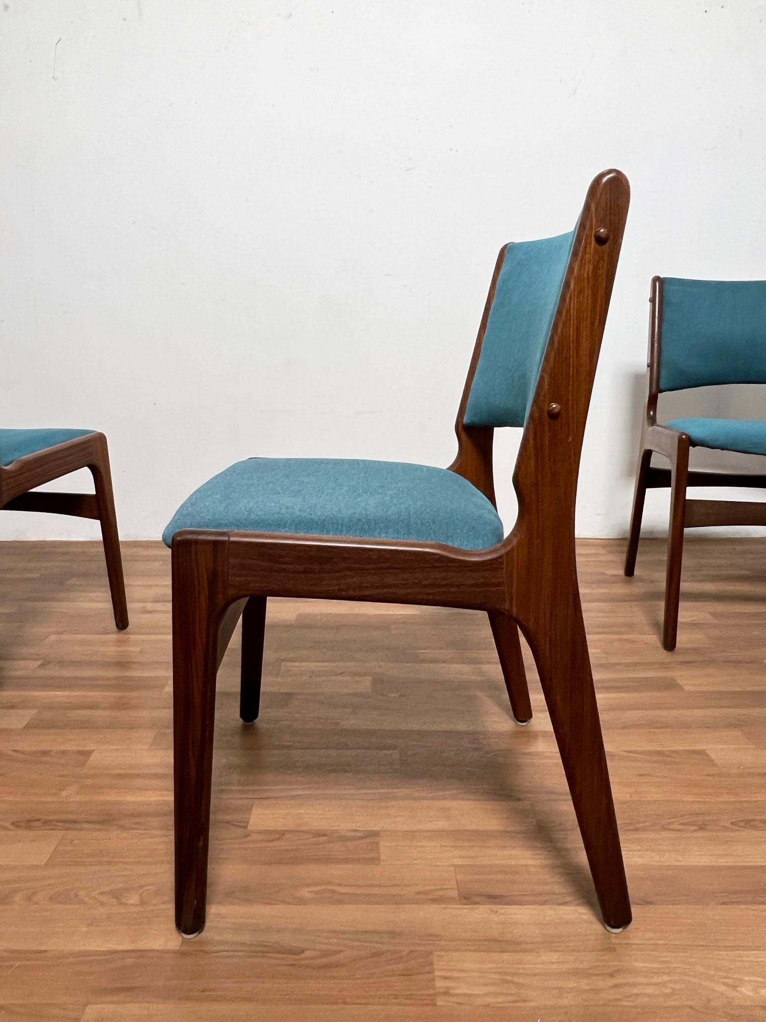 A set of eight Danish teak dining chairs, model #89 by designer Erik Buch for Anderstrup Mobelfabrik, ca. 1960s.