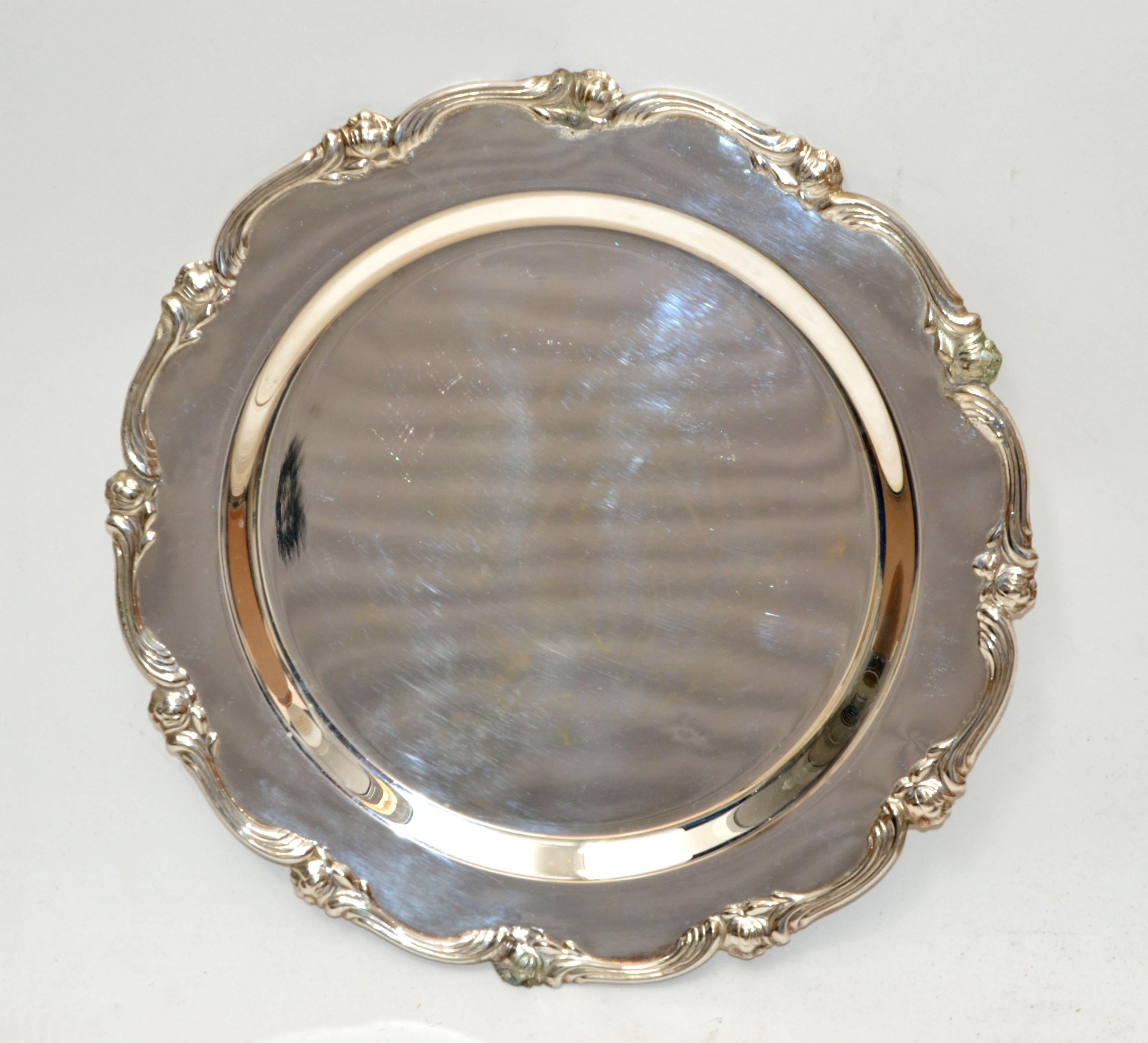 Elegant handmade set of eight finest silver plate serving chargers underplates mats. 
Measure: Gadroon edged 11.5 inches diameter, lightly used and minor signs of wear.
Have the original red felt protectors in between.
Marked under each plate: