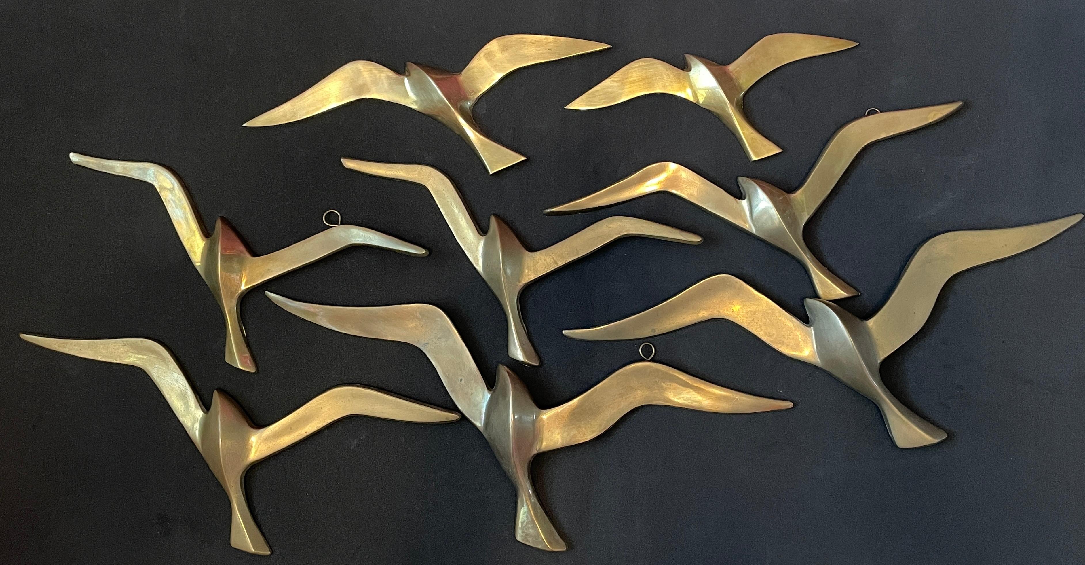 A set of eight beautiful vintage brass flying swallow wall decorations. Each would make a beautiful ornament on a wall. They are with some patina and are an excellent craftsmanship. Made in the 1960s it displays the joy of that great era with a