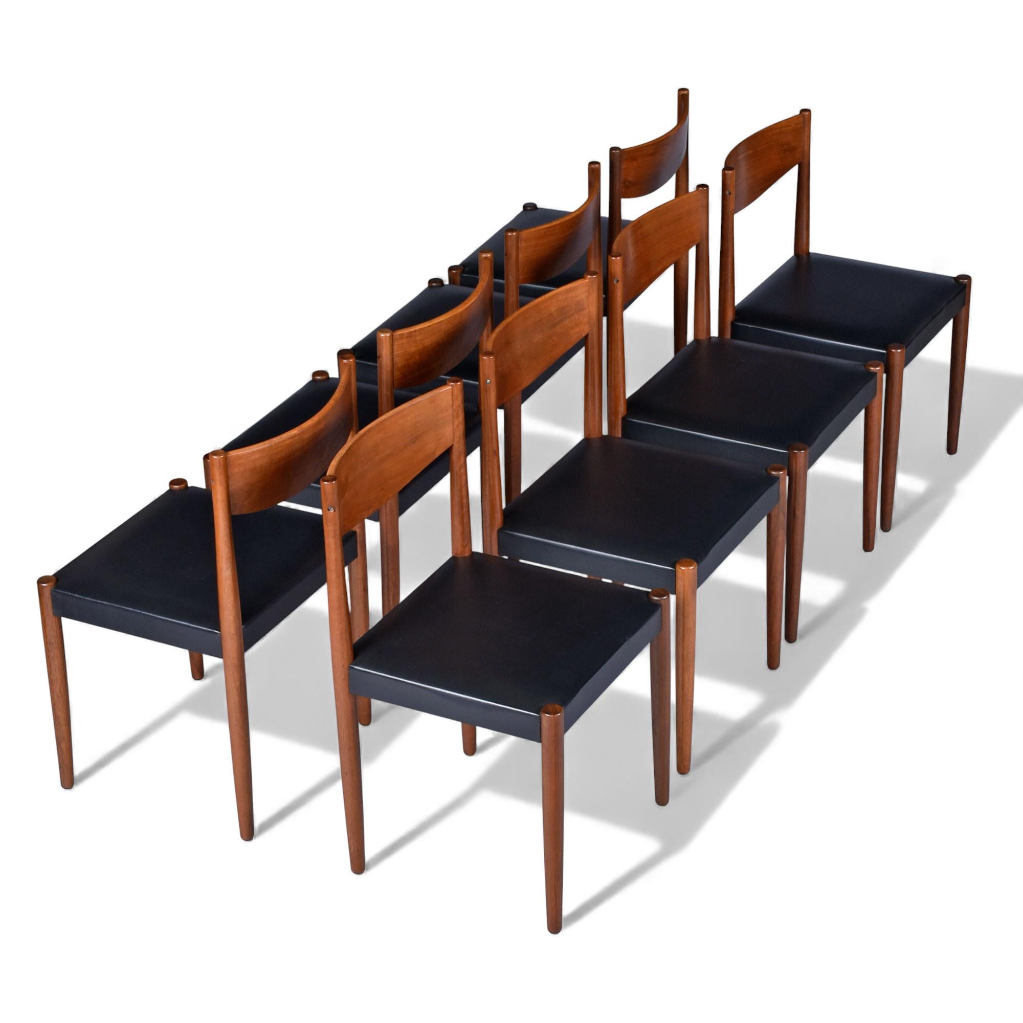 Excepcional juego de ocho sillas de comedor danesas modernas de teca de Frem Røjle, modelo 217, fabricadas en Dinamarca a principios de la década de 1960. Frem Røjle es célebre por su mano de obra de precisión y su elegante minimalismo, más conocido