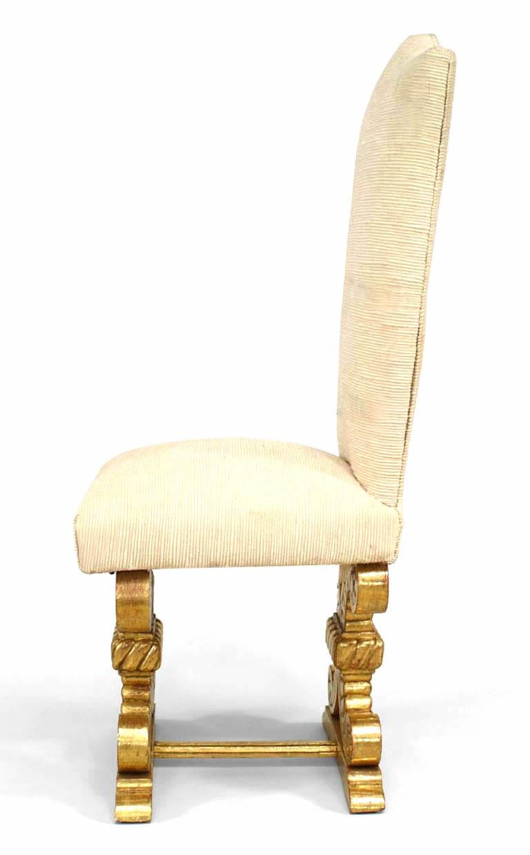 Set of 8 French 1940s side chairs with arched upholstered back & seat on gilt carved crossed plume form legs joined by a stretcher. (att: ROBERT PAVEAU)
