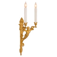 Juego de ocho candelabros neoclásicos franceses de dos brazos en ormolina del siglo XIX