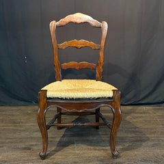 Set of Eight French Louis XV Style Walnut Dining Chairs with Rush Seats