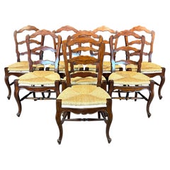 Set of Eight French Louis XV Style Walnut Dining Chairs with Rush Seats