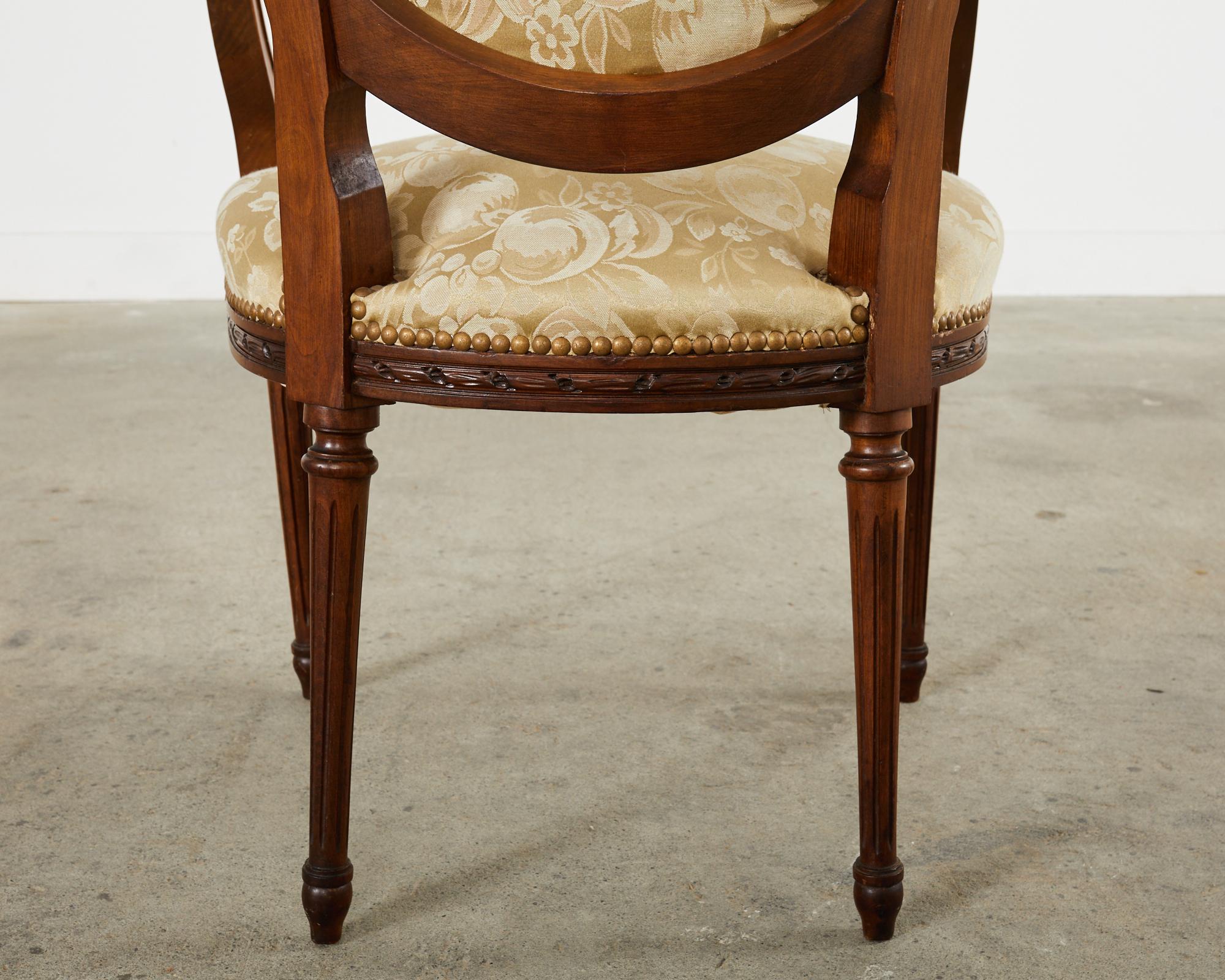 Set of Eight French Louis XVI Style Walnut Dining Chairs 11