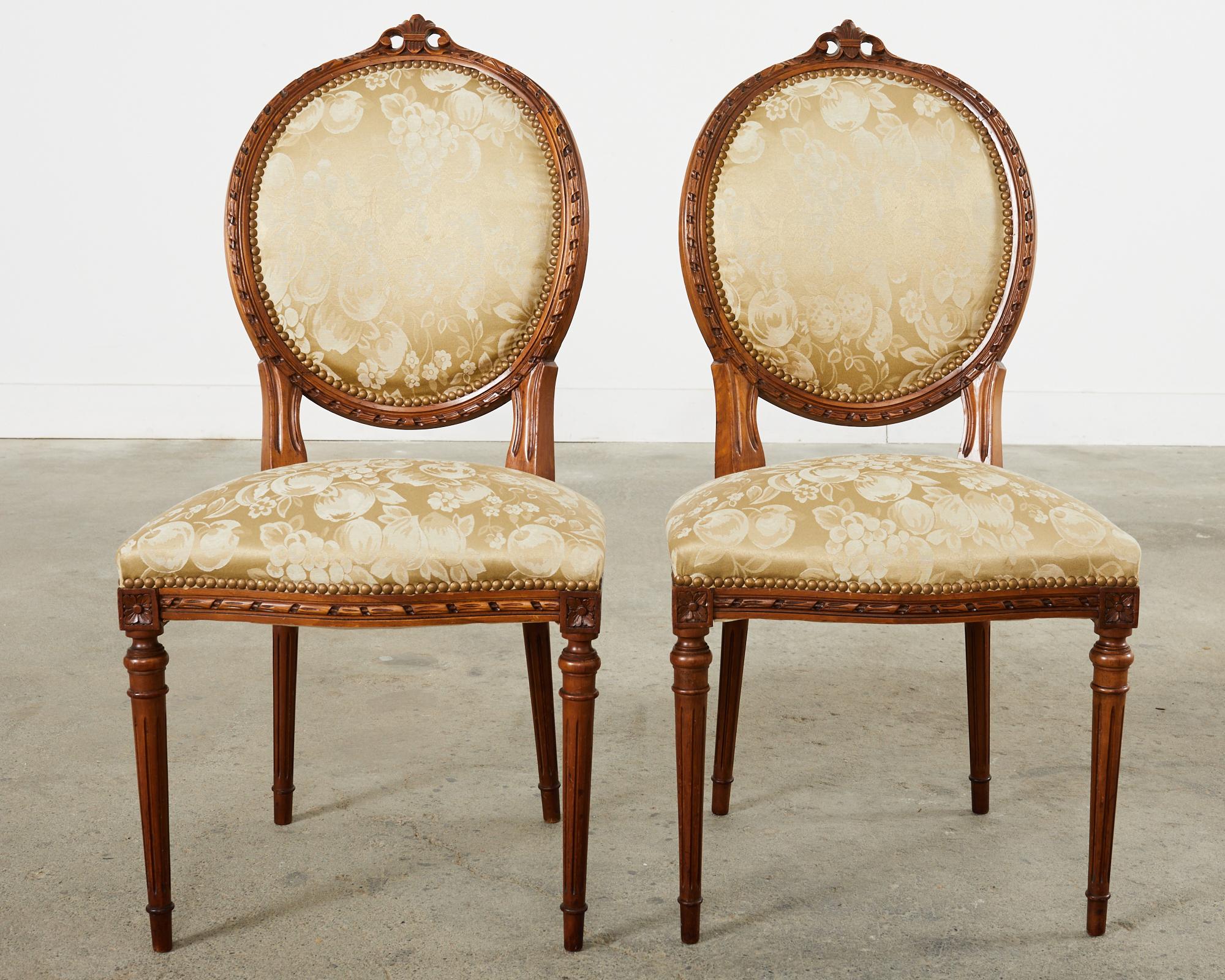 Set of Eight French Louis XVI Style Walnut Dining Chairs 12