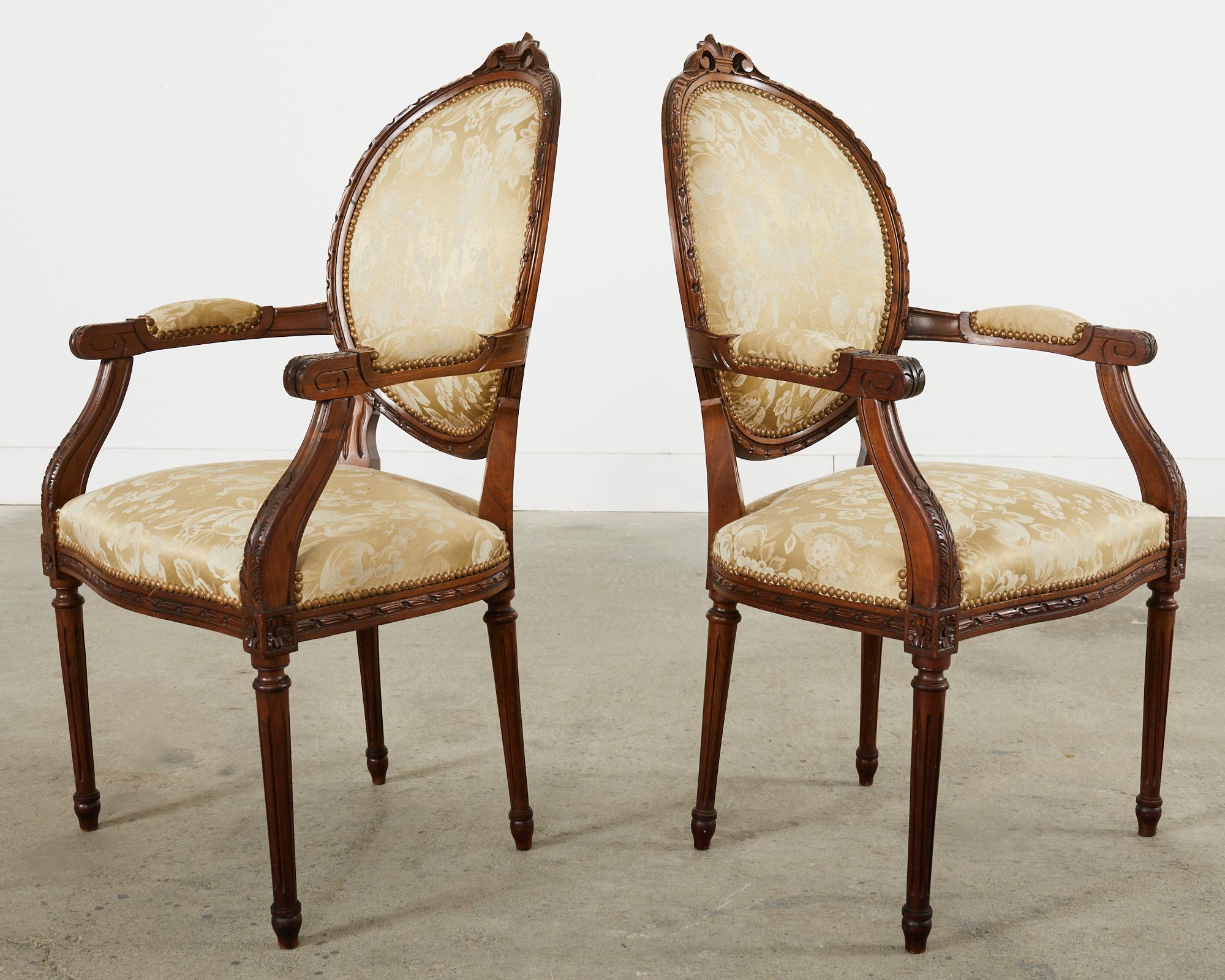 Set of Eight French Louis XVI Style Walnut Dining Chairs 1