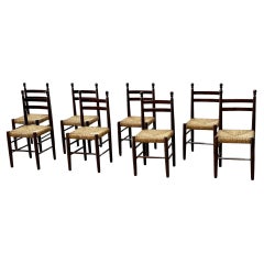 set of eight french oak and rattan dining chairs attributed to Charles Dudouyt