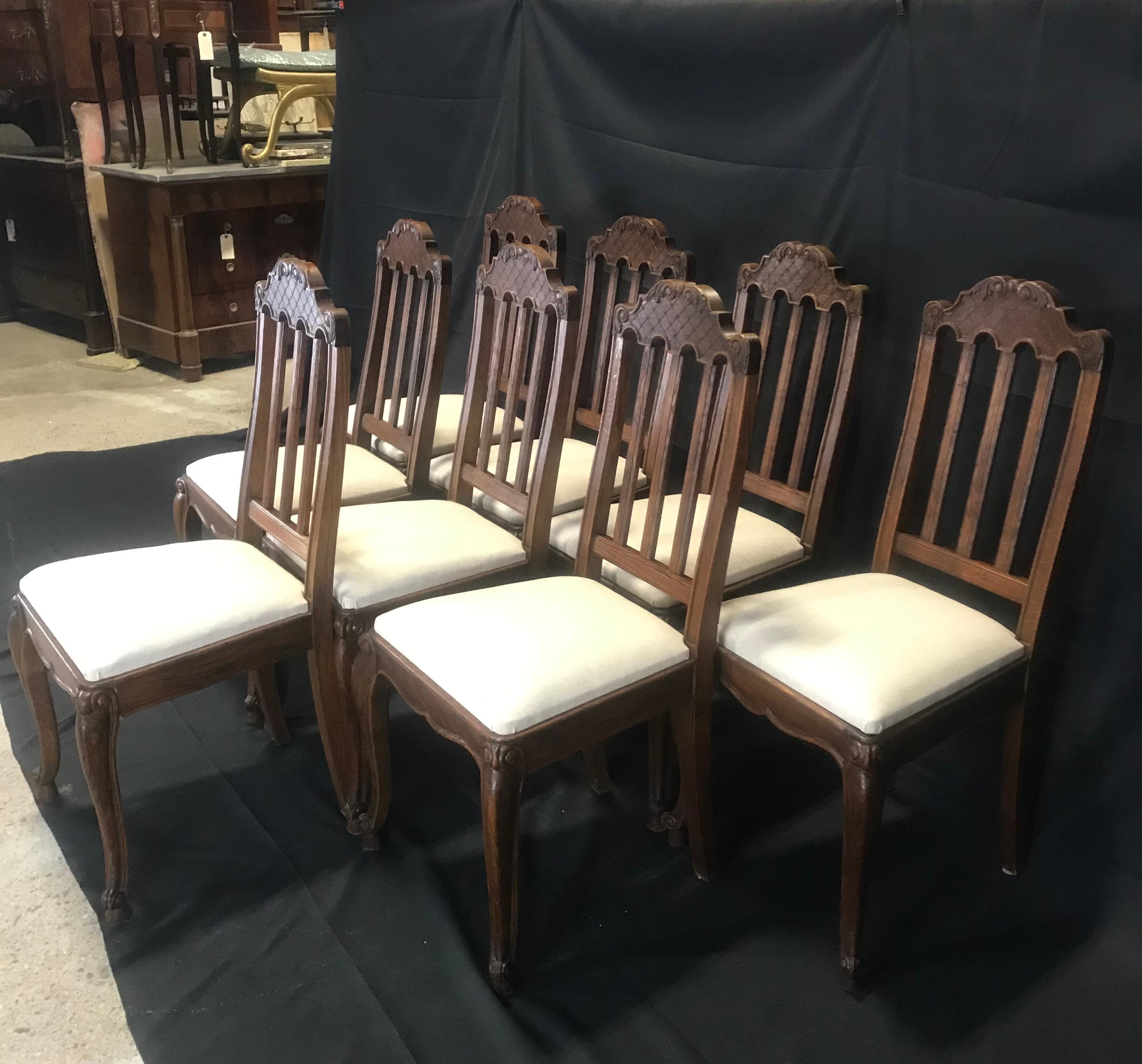 19th Century Set of Eight French Oak Intricately Carved Louis XV Chairs with Snail Feet