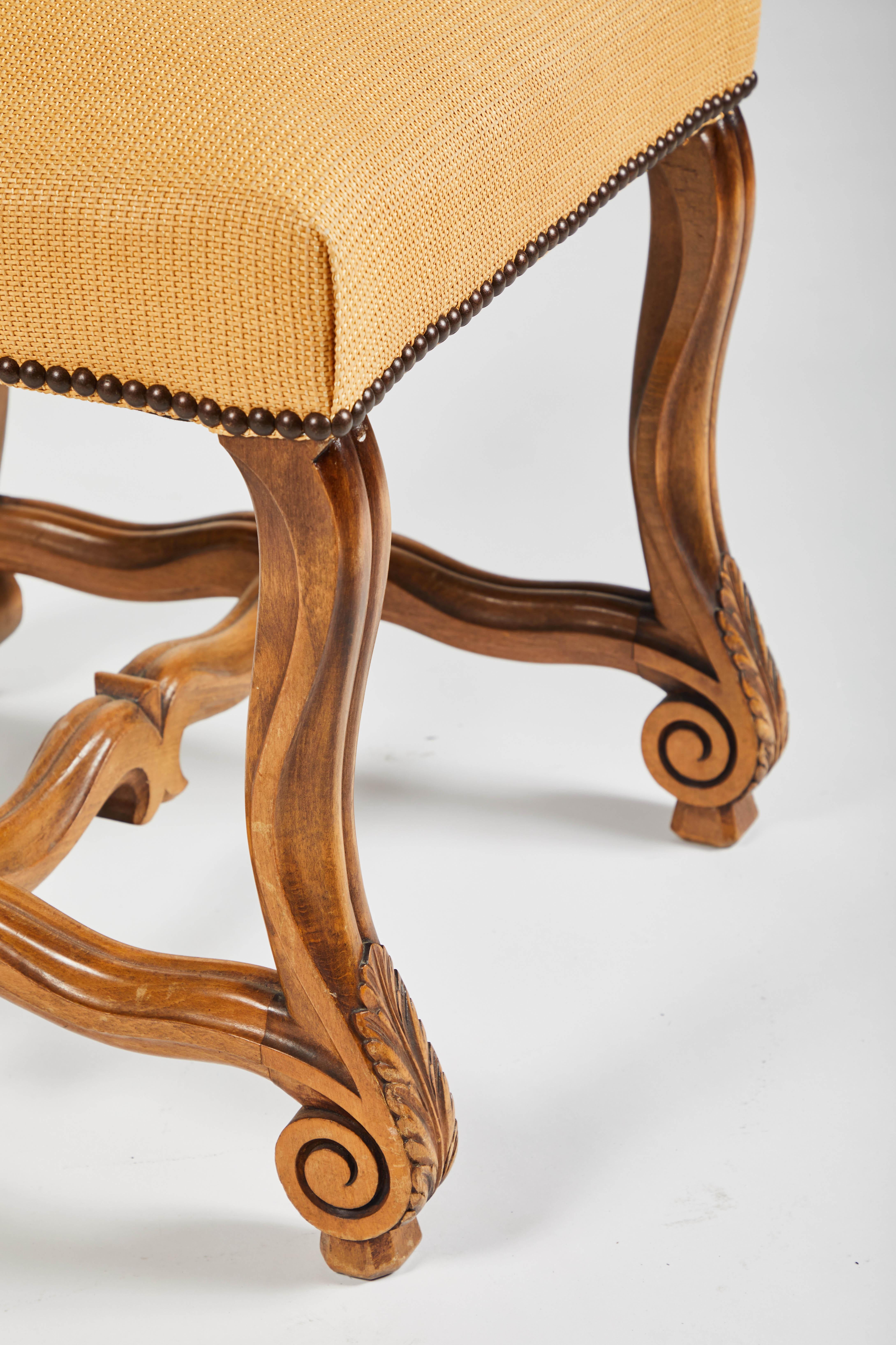 This group of eight side chairs are in the Louis XIV style with H-shaped mutton bone stretchers (Os De Mouton). The wood is a nice warm French oak with nailhead trim. Very strong pegged frame, beautiful patina on wood. 

Perfect around your