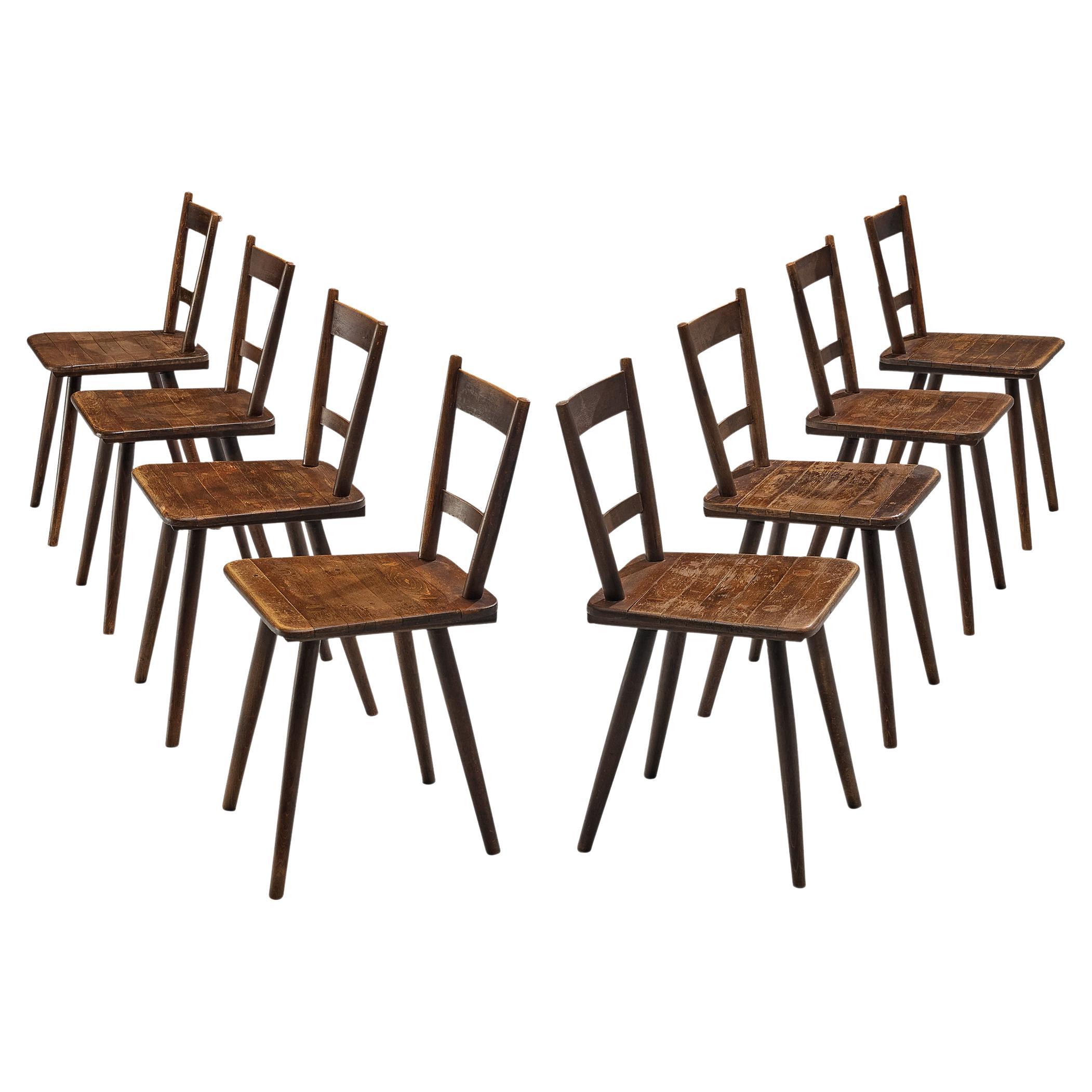 Set of Eight French Pastoral Dining Chairs in Stained Wood For Sale