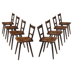 Set of Eight French Pastoral Dining Chairs in Stained Wood