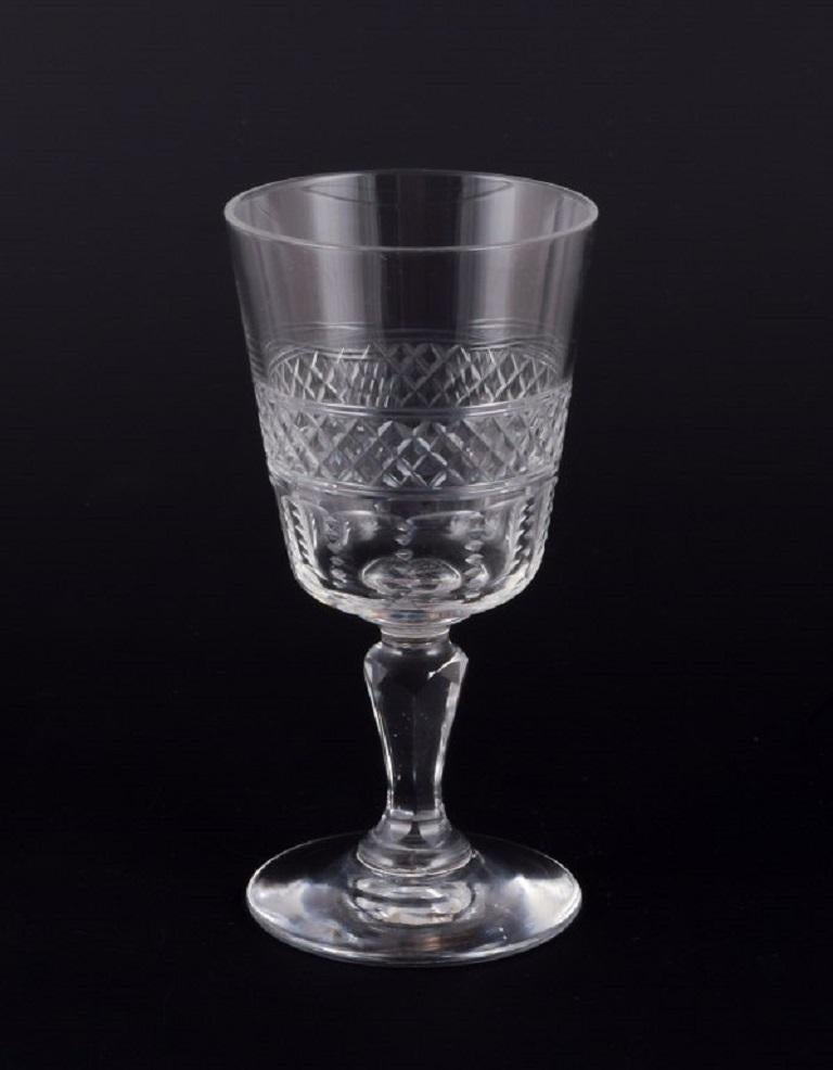 A set of eight mouth-blown French port wine glasses in crystal glass. Faceted. Handmade. 
Circa 1900. 
Perfect condition. 
Dimensions: H 10.0 cm x D 4.5 cm.