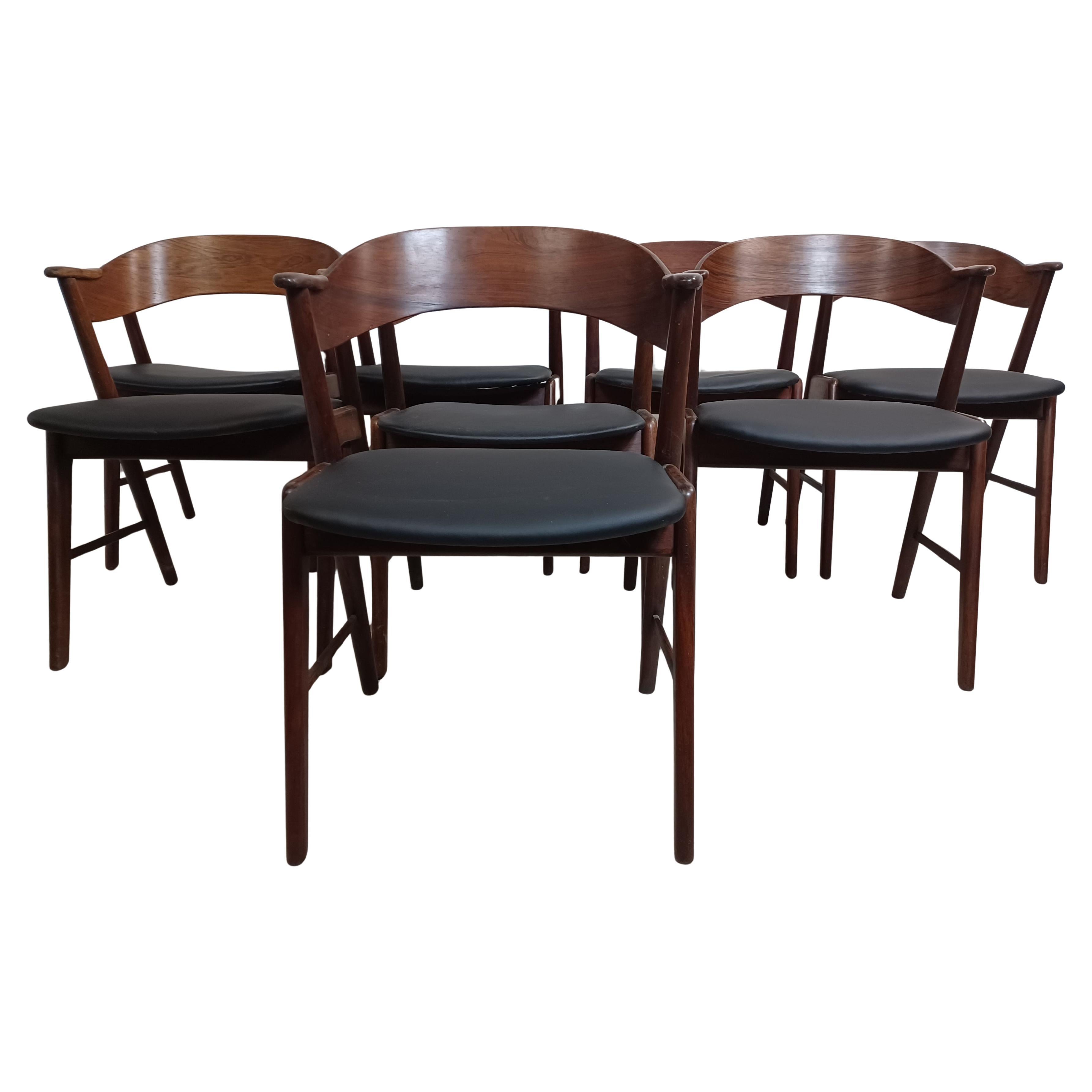 Set of Eight Fully Restored Rosewood Dining Chairs in Black Leather Upholstey
