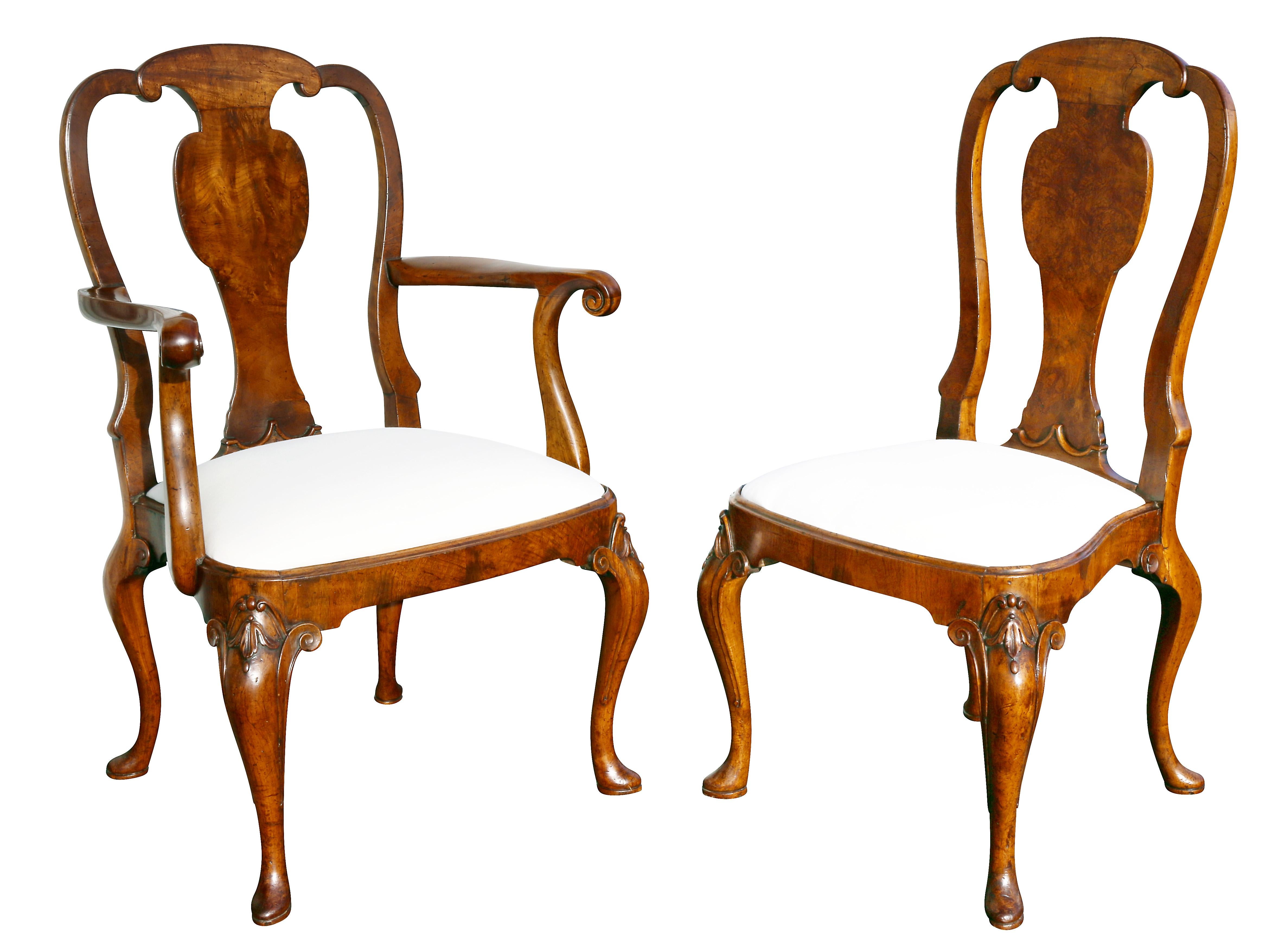 Each with an arched back and vasiform splat with drop in upholstered seat raised on cabriole legs carved with scrolled and bellflower carved knees. Comprising a pair of armchairs and six side chairs.