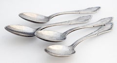 Set of Eight German Silver-plate Demitasse Spoons.