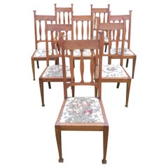 Set of Eight Golden Oak Arts & Crafts Dining Chairs Retaining the Original Label