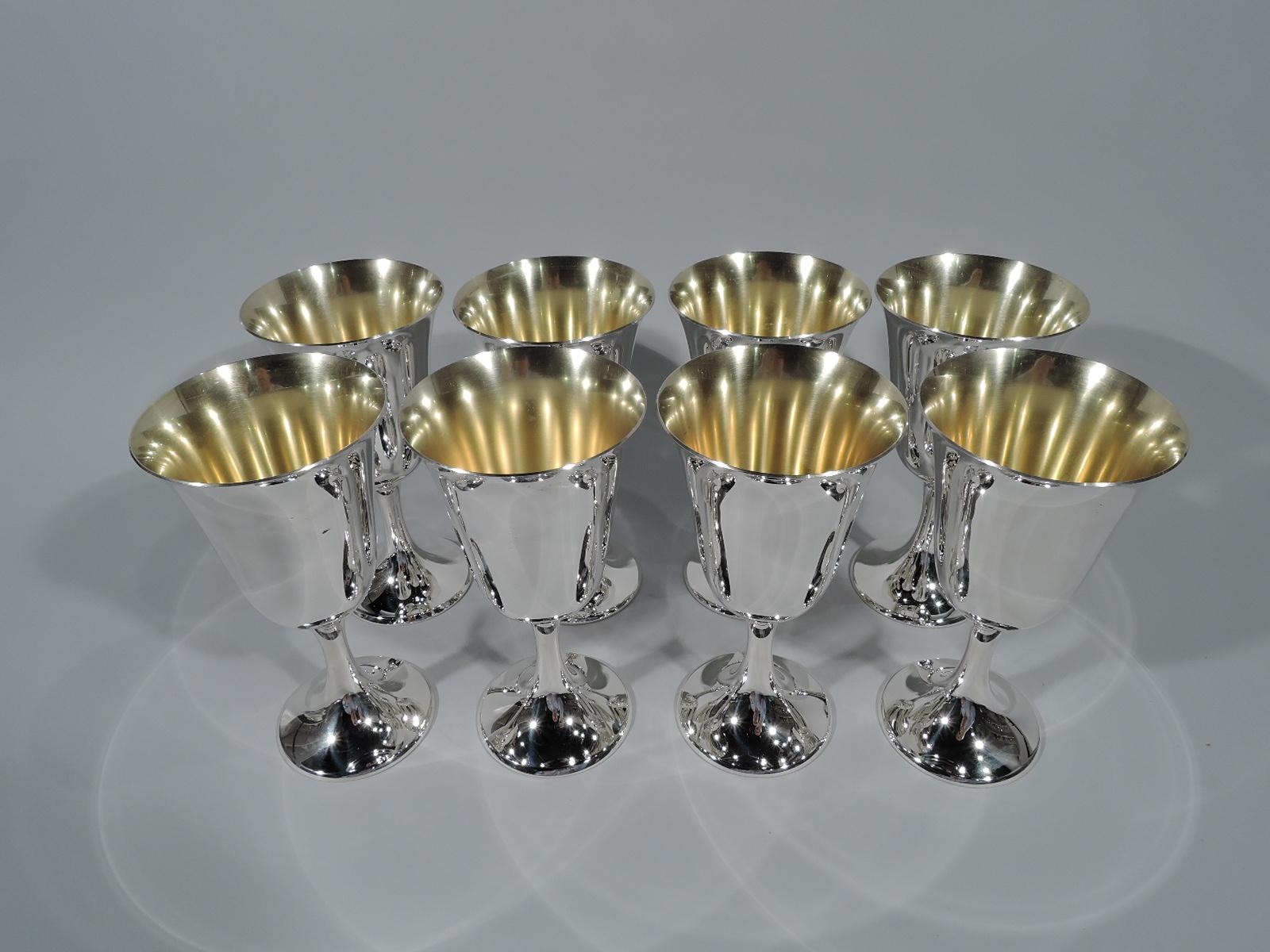 Set of eight sterling silver goblets. Made by Gorham in Providence. Each: Tapering bowl with flared rim, slender stem, and raised foot. Gilt-washed interior. Hallmark includes no. 272. Total weight: 48 troy ounces.