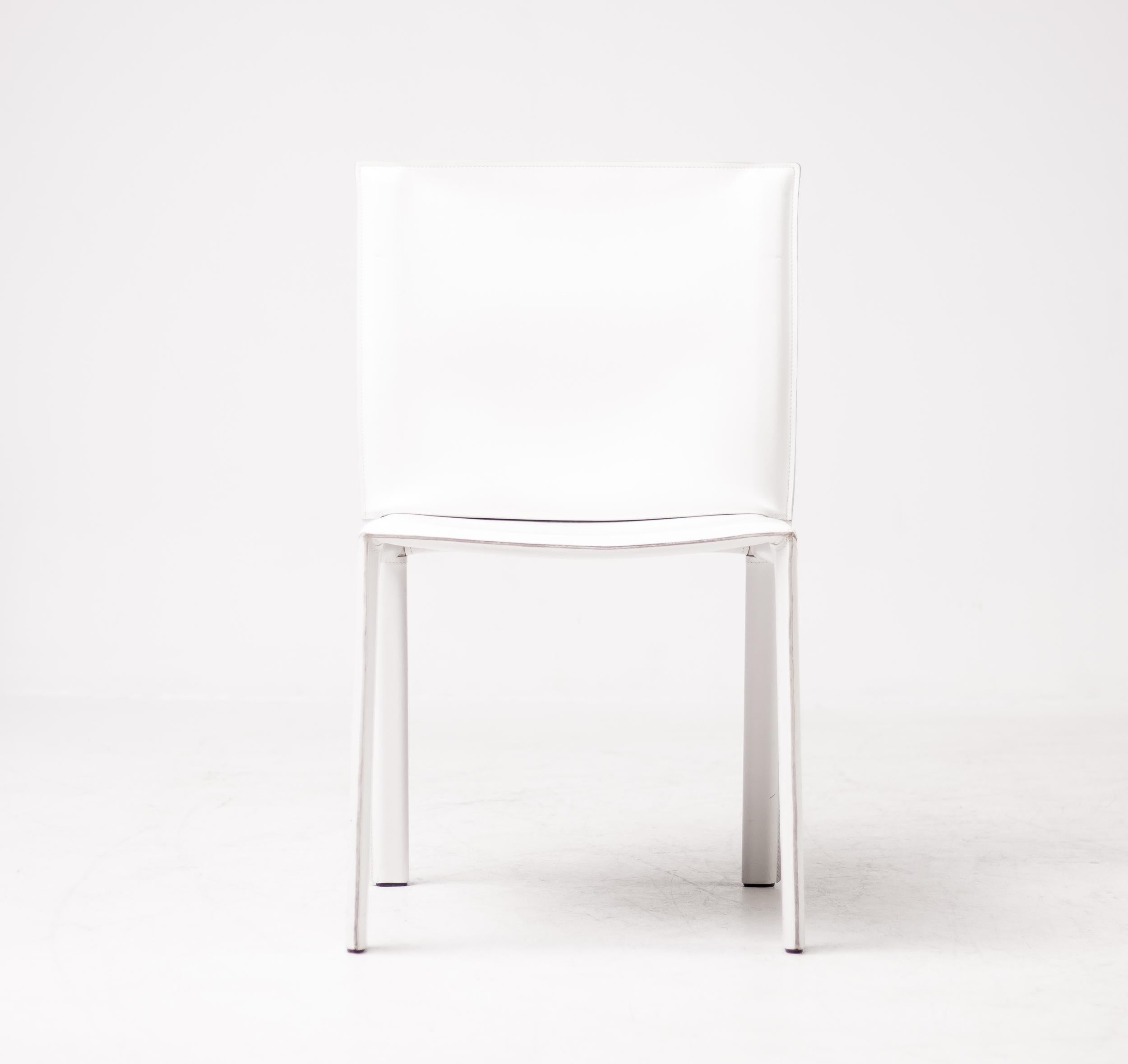 Gorgeous set of 8 Enrico Pellizzoni Pasqualina chairs designed by Grassi & Bianchi. These chairs are covered in wonderful white all grain leather. The chairs were purchased in 2010 and are meticulously maintained. 
They are in excellent condition
