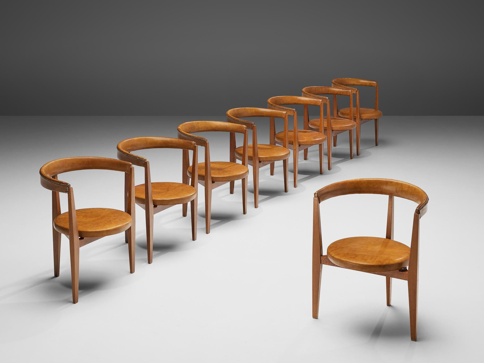 Guido Canali, set of eight dining chairs, walnut, leather, brass, Italy, 1960s

This set is one of the rare furniture designs of architect Guido Canali (born 1935). The chairs, designed by Canali at the early stages of his career, were inspired by