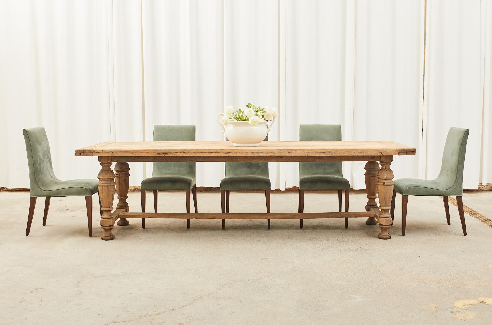 Bespoke set of eight modern style dining chairs crafted from hardwood frames. The chairs feature a gracefully curved seat upholstered with an Ultrasuede fabric in a laurel green shade color. Custom ordered from the design center in San Francisco,