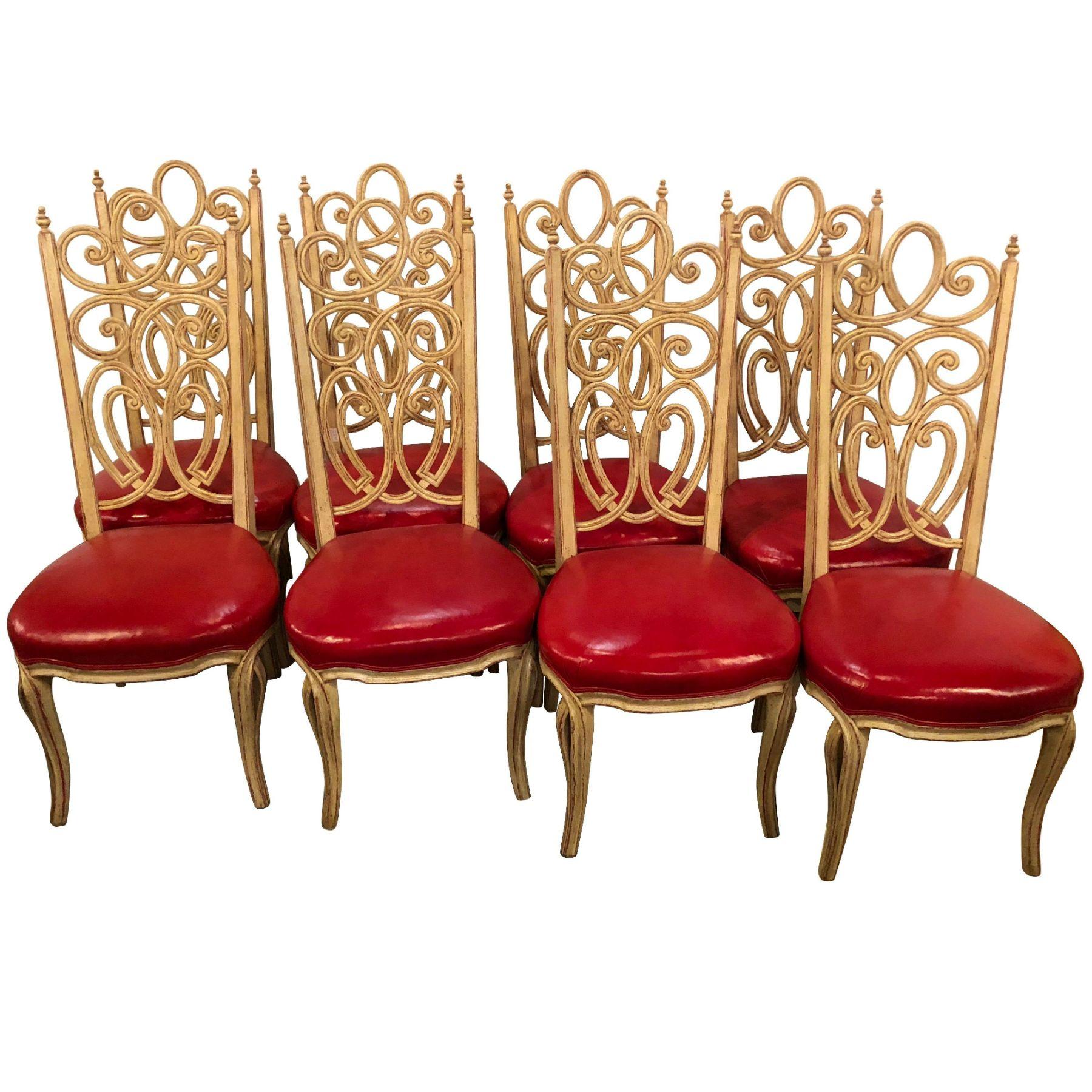 A fine set of eight Louis Pistono white distressed dining chairs. Each having a carved ribbon back with red under paint on a distressed off-white frame. This Fine set by the highly sought after furniture maker Louis Pistono (French/Canadian,